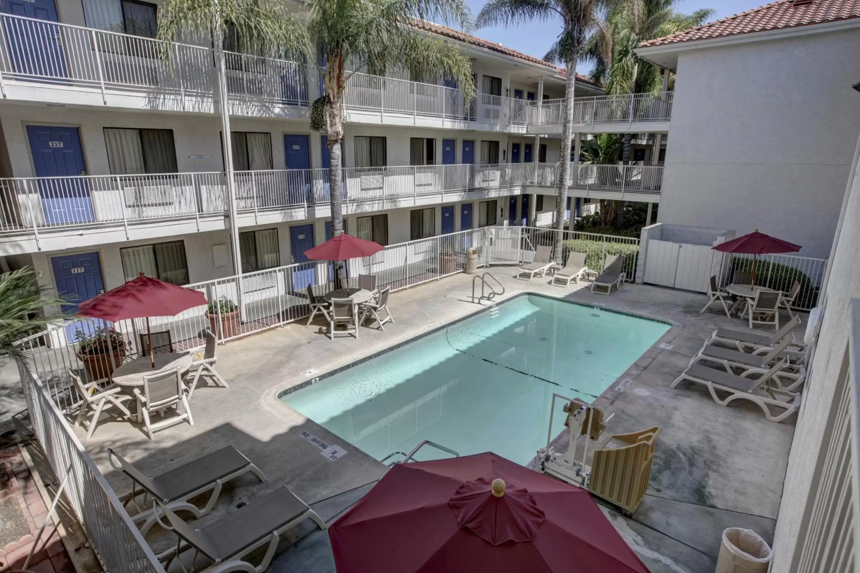 Facade/entrance, Pool View in Motel 6-Bellflower, CA - Los Angeles