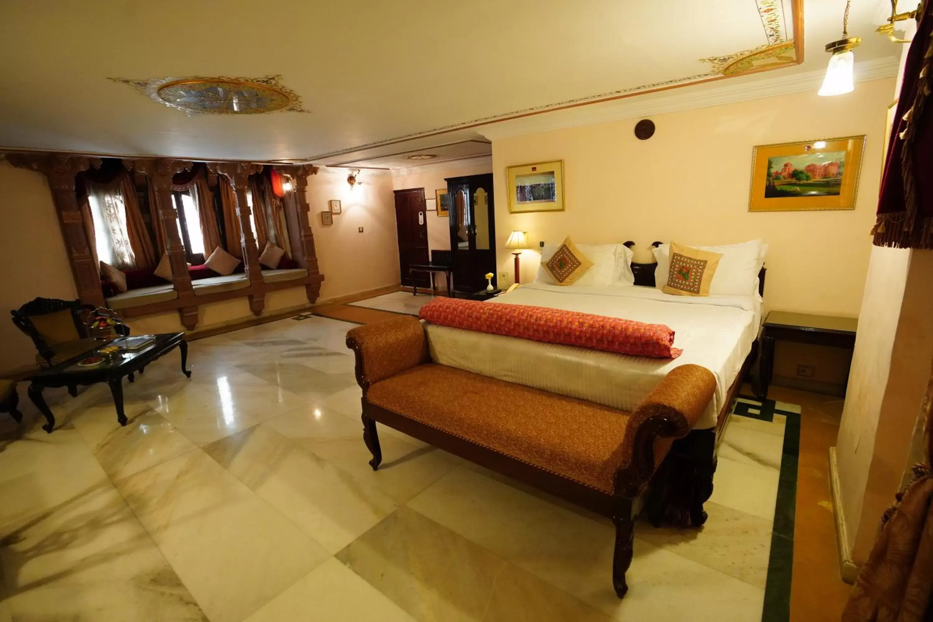 Bed, Seating Area in The Laxmi Niwas Palace