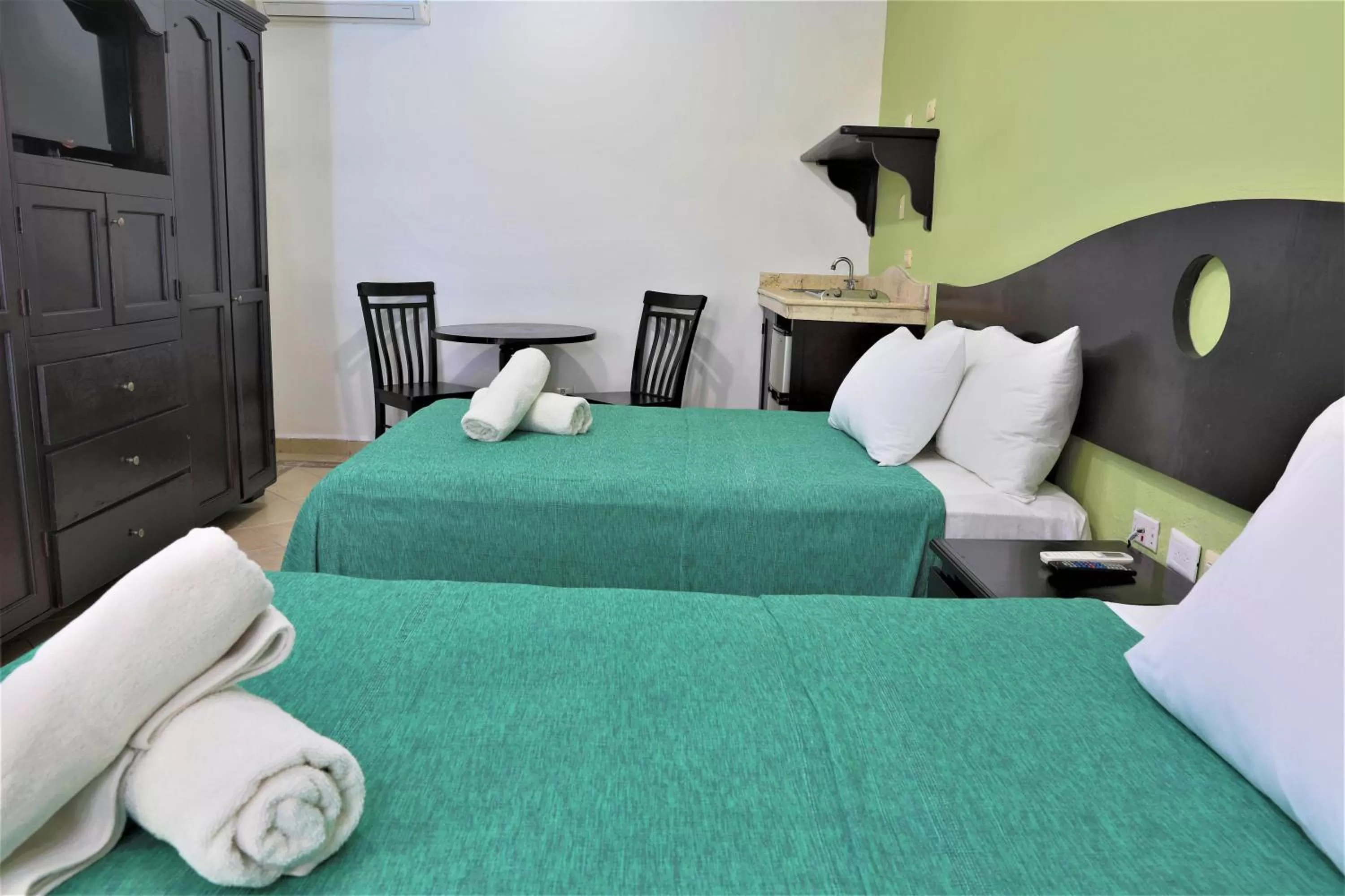 Photo of the whole room, Bed in Hotel Colonial Playa del Carmen