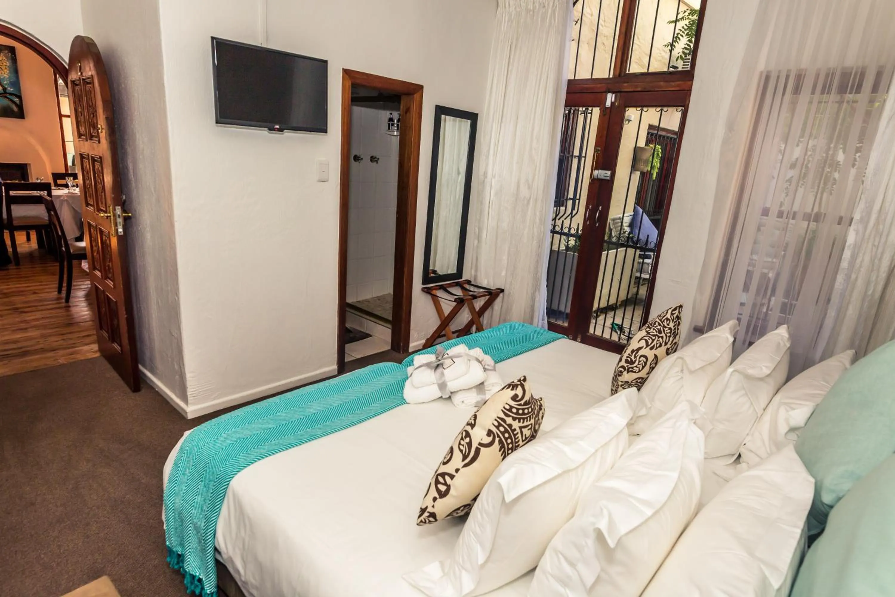 Bed in Point B Guest House -Sustainable Solar Energy