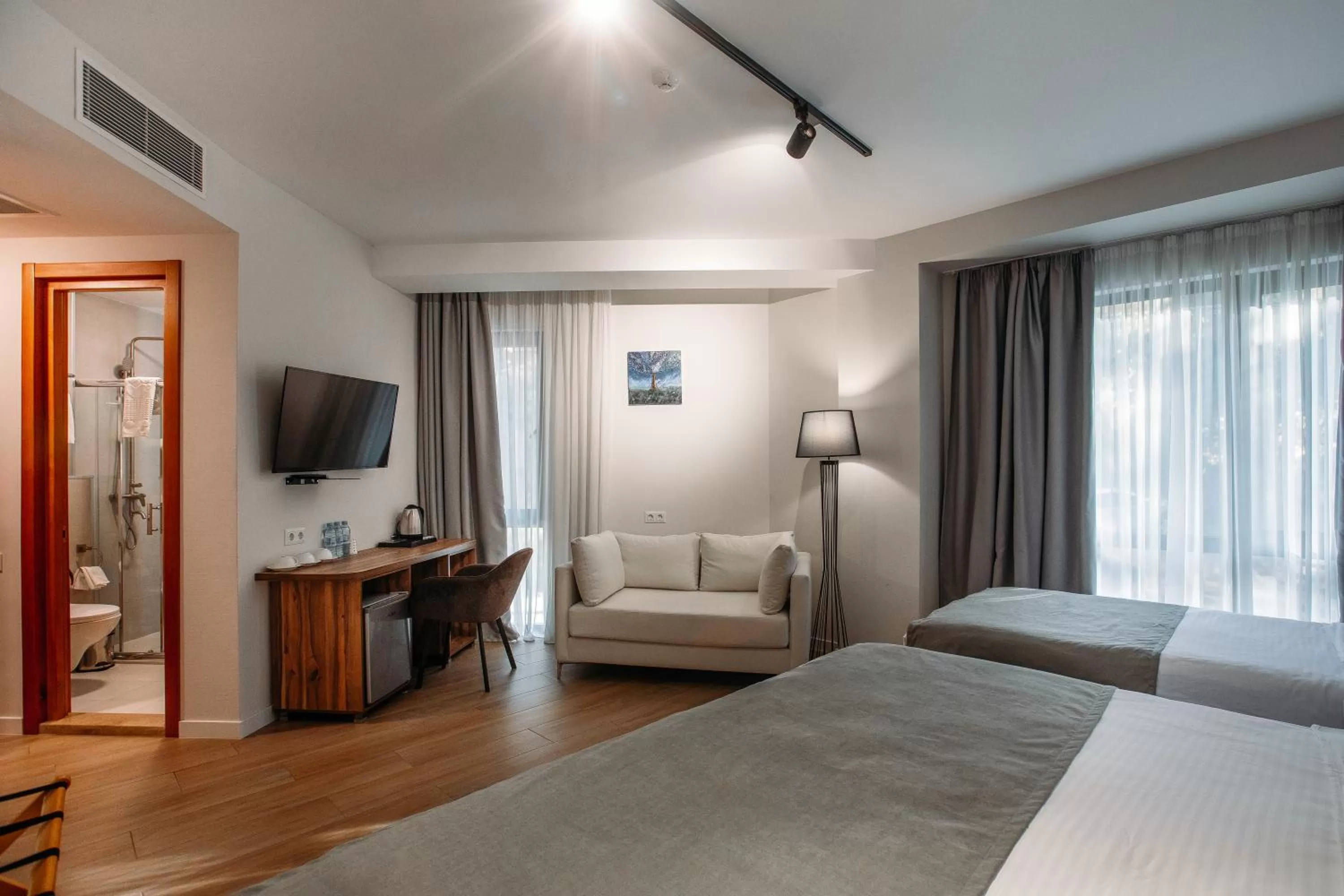 Seating area, Bed in Address Boutique Hotel