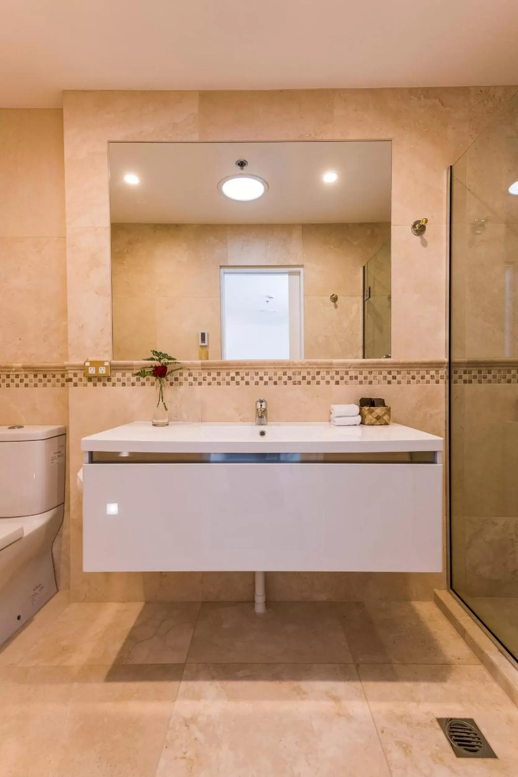 Bathroom in Fino Hotel & Suites