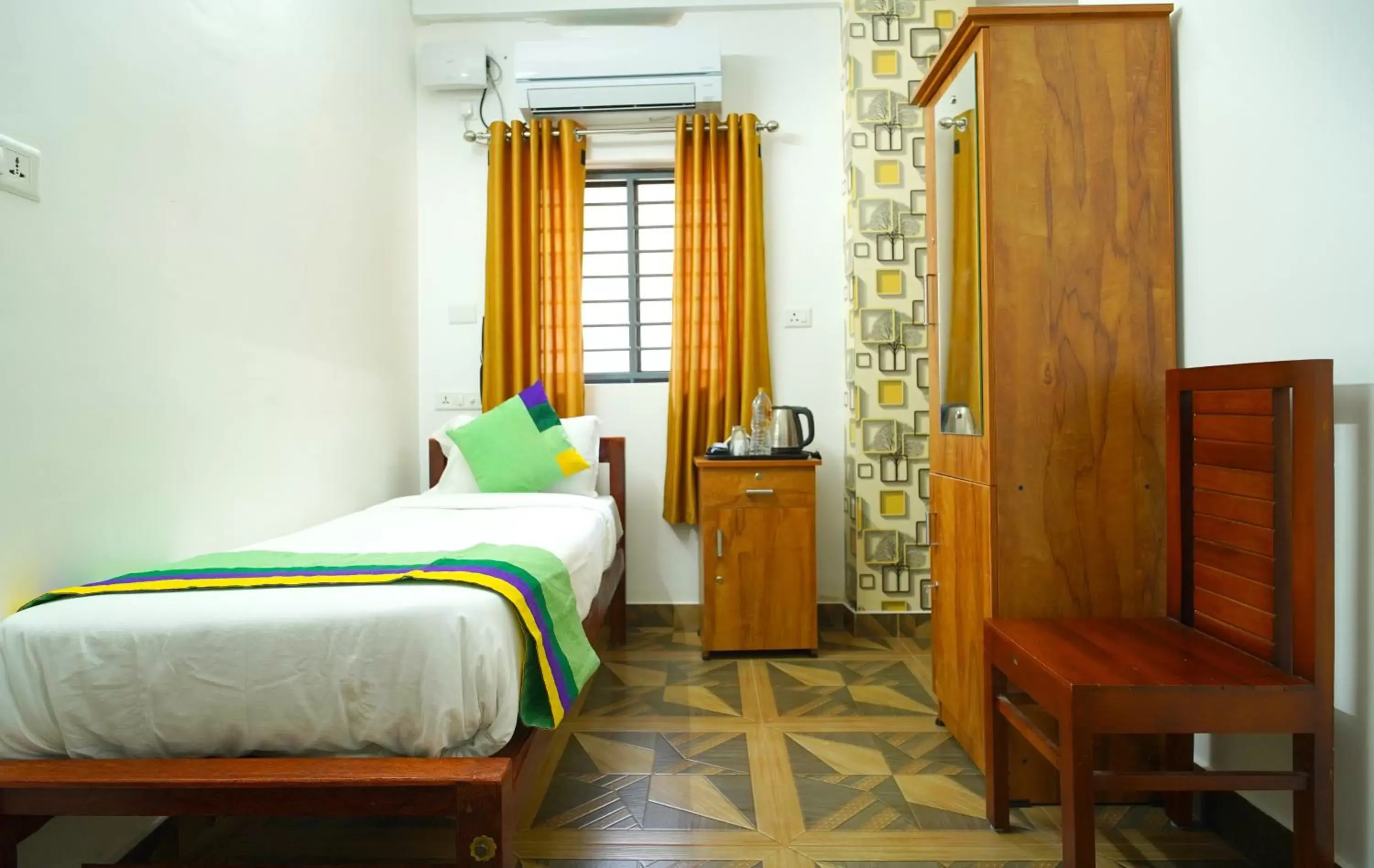 Bed in Treebo Trend Nirupama Apartment