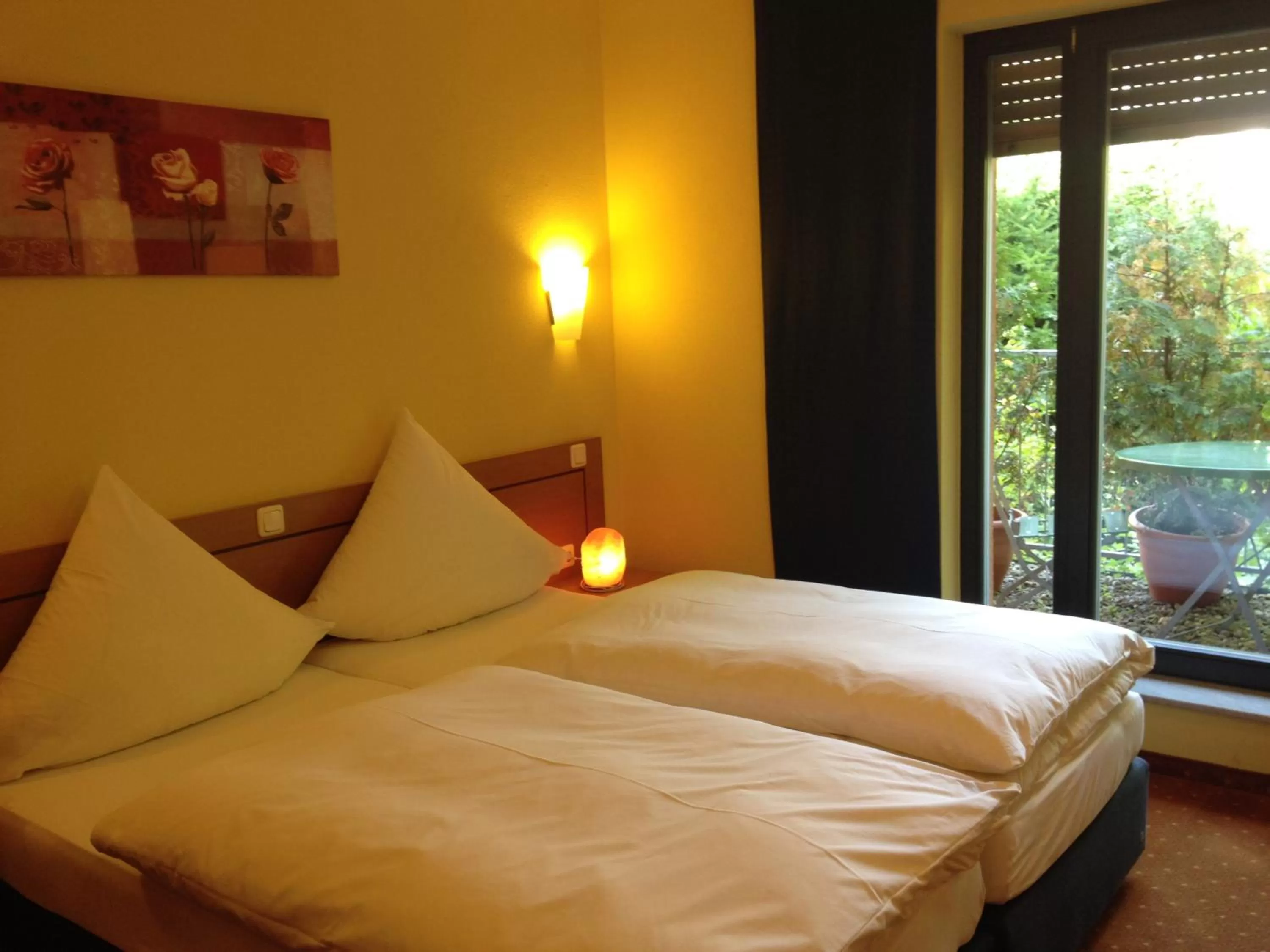 Photo of the whole room, Bed in BIO Hotel Bayerischer Wirt Augsburg