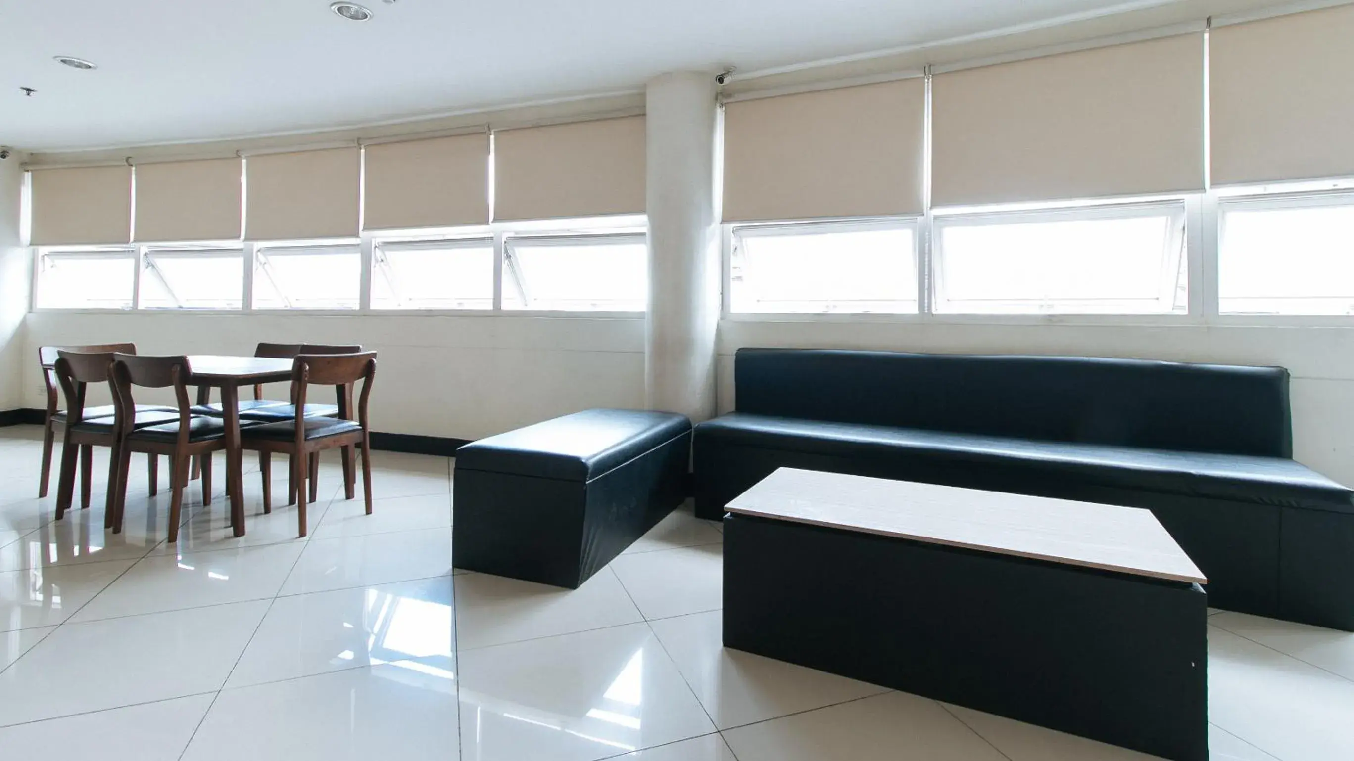 Seating Area in RedDoorz Plus at EDSA Congressional - Vaccinated Staff