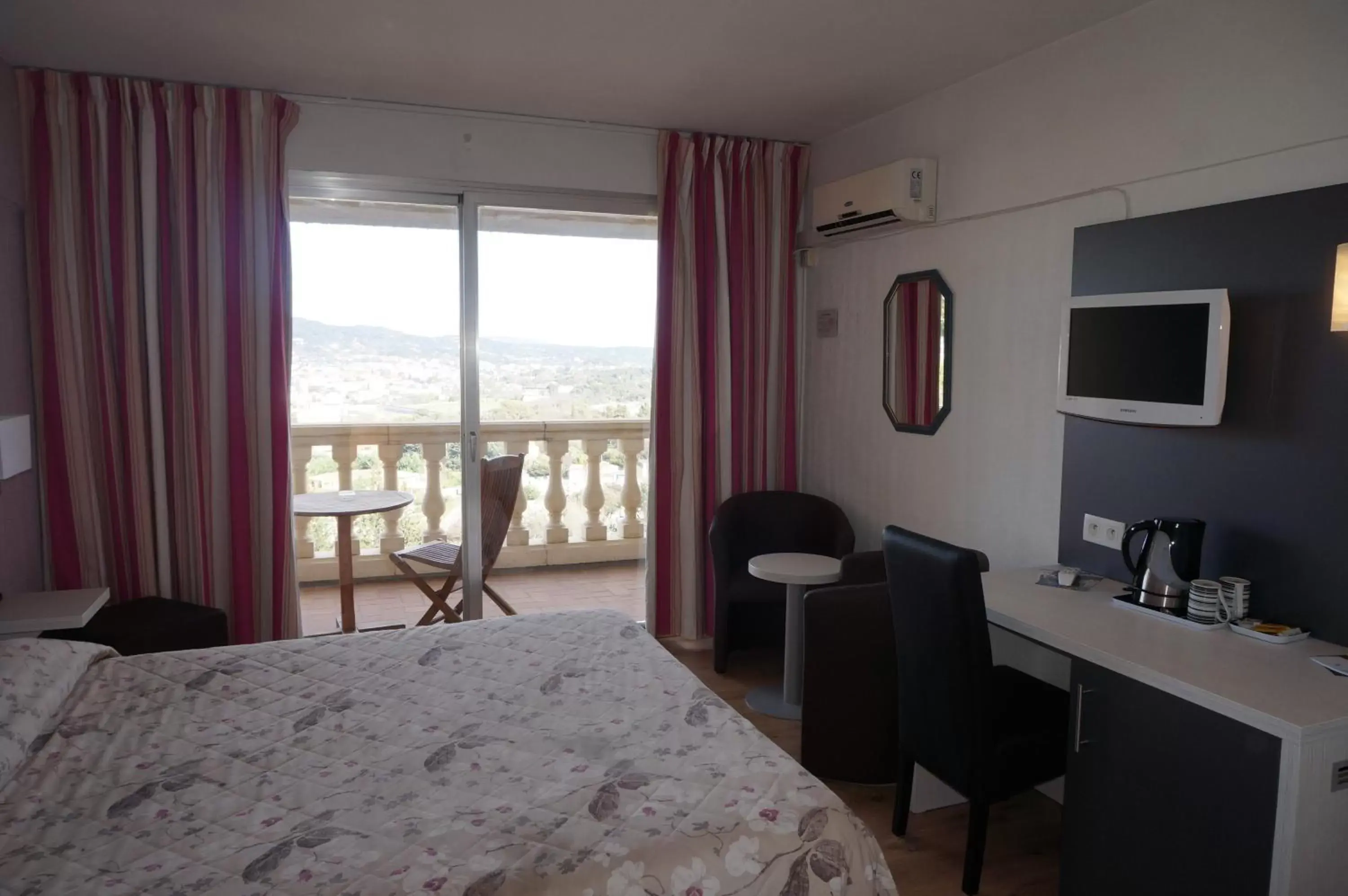 Bedroom in Logis Hotel Le Col De L'ange