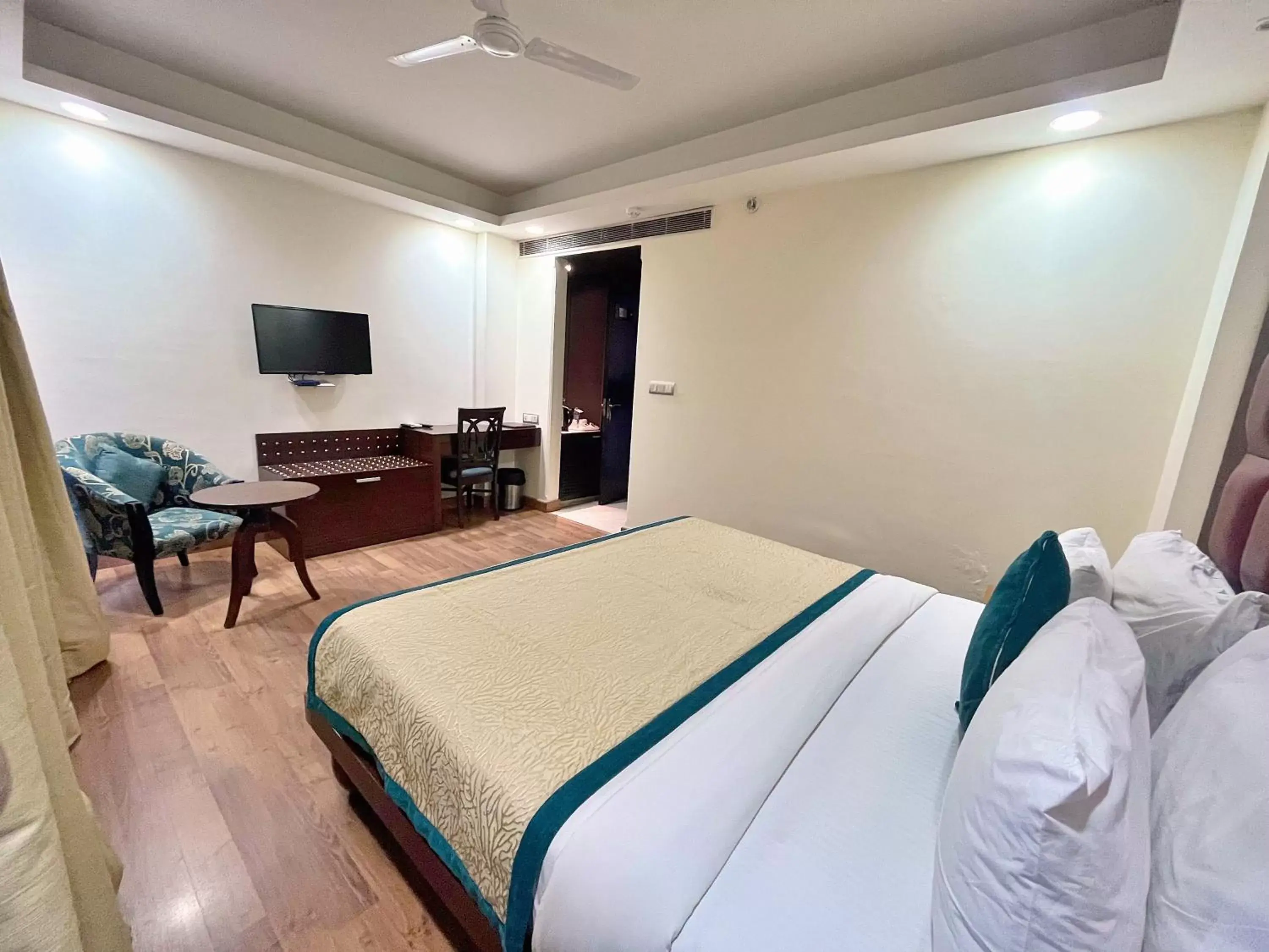 Bed in The Grand Orion - Kailash Colony