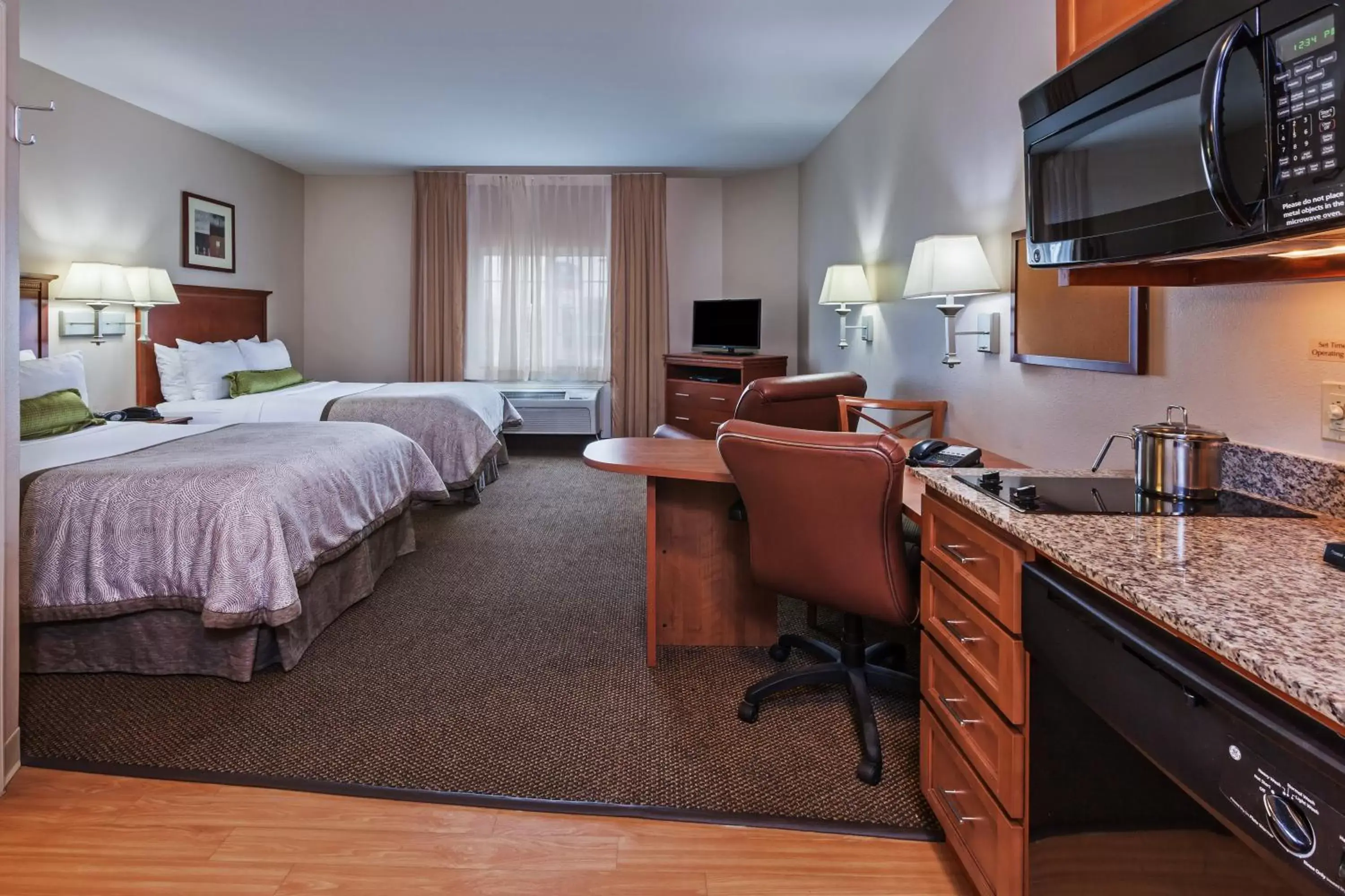 Photo of the whole room in Candlewood Suites Deer Park, an IHG Hotel