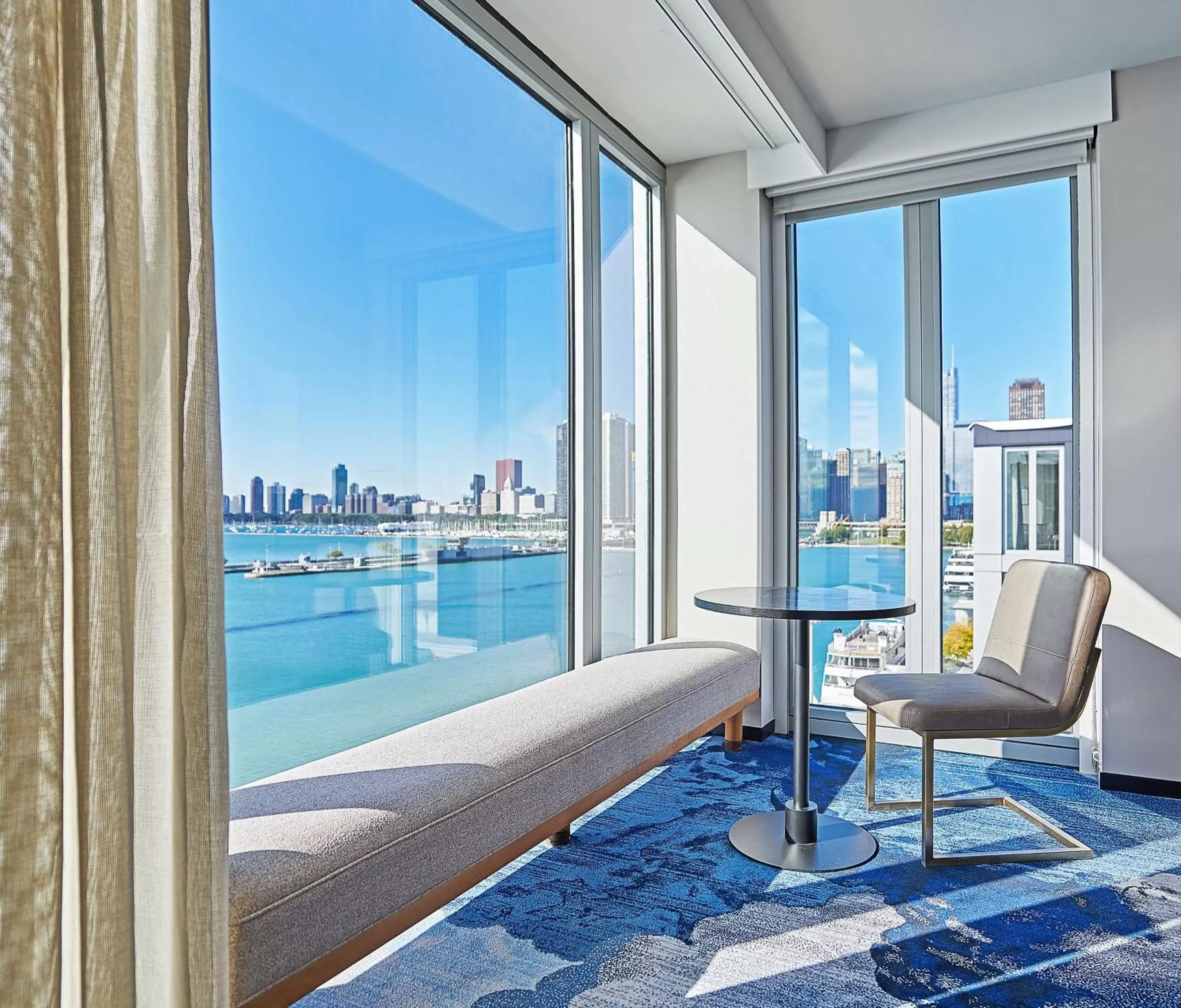 Living room, Swimming Pool in Sable At Navy Pier Chicago, Curio Collection By Hilton