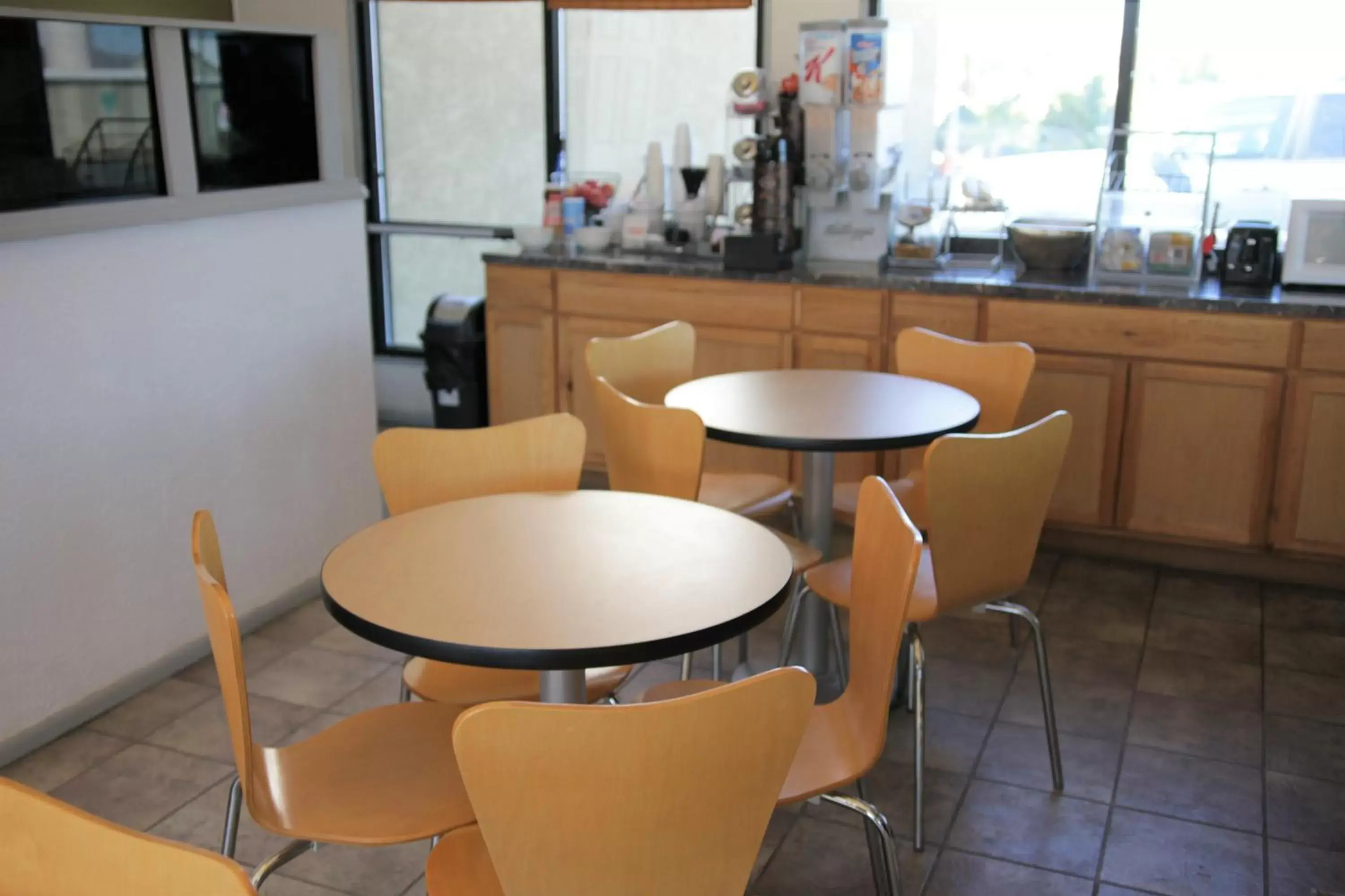 Dining area in Super 8 by Wyndham Wells Dining area in Super 8 by Wyndham Wells