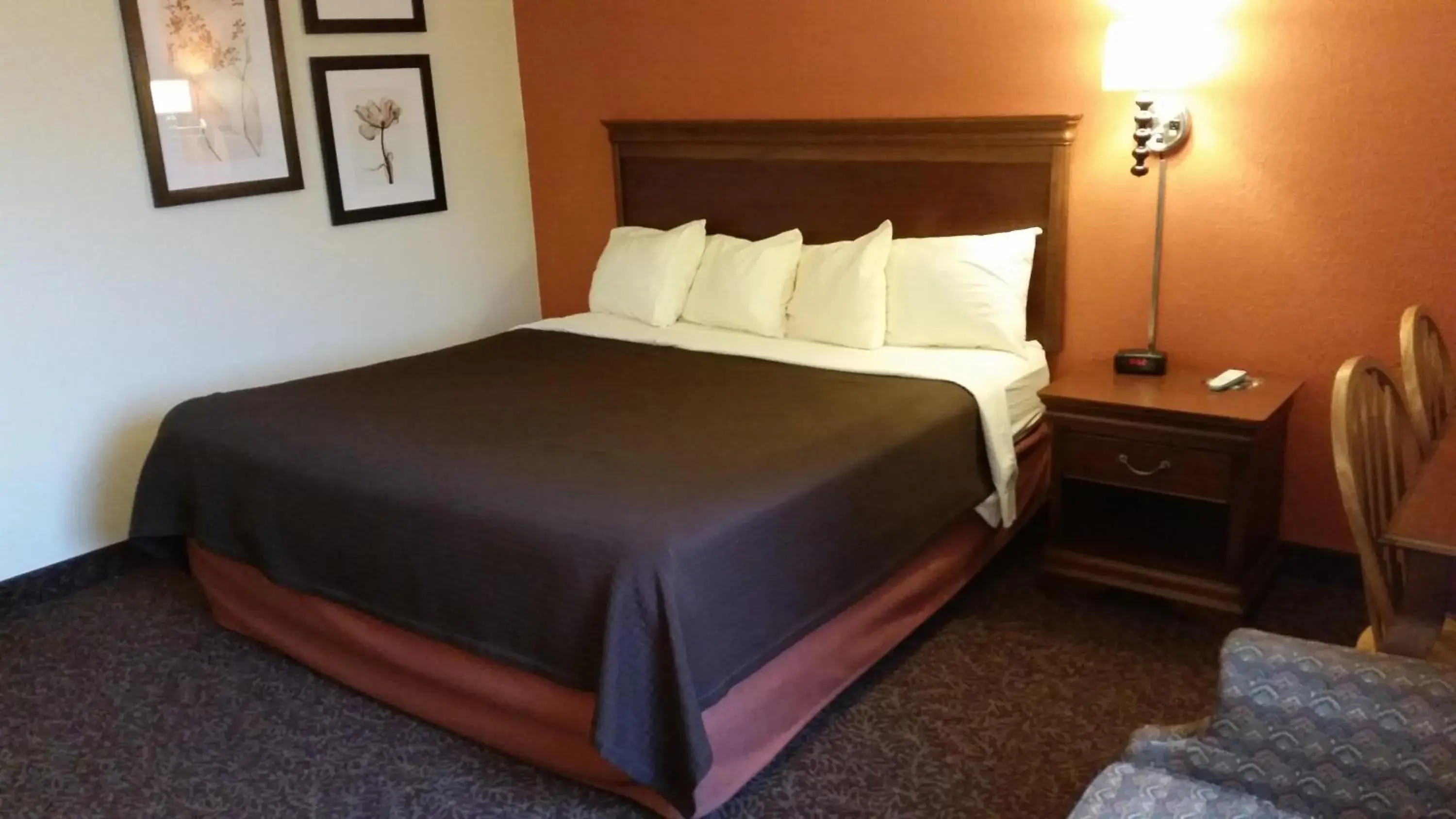 Bed in AmericInn by Wyndham Forest Lake