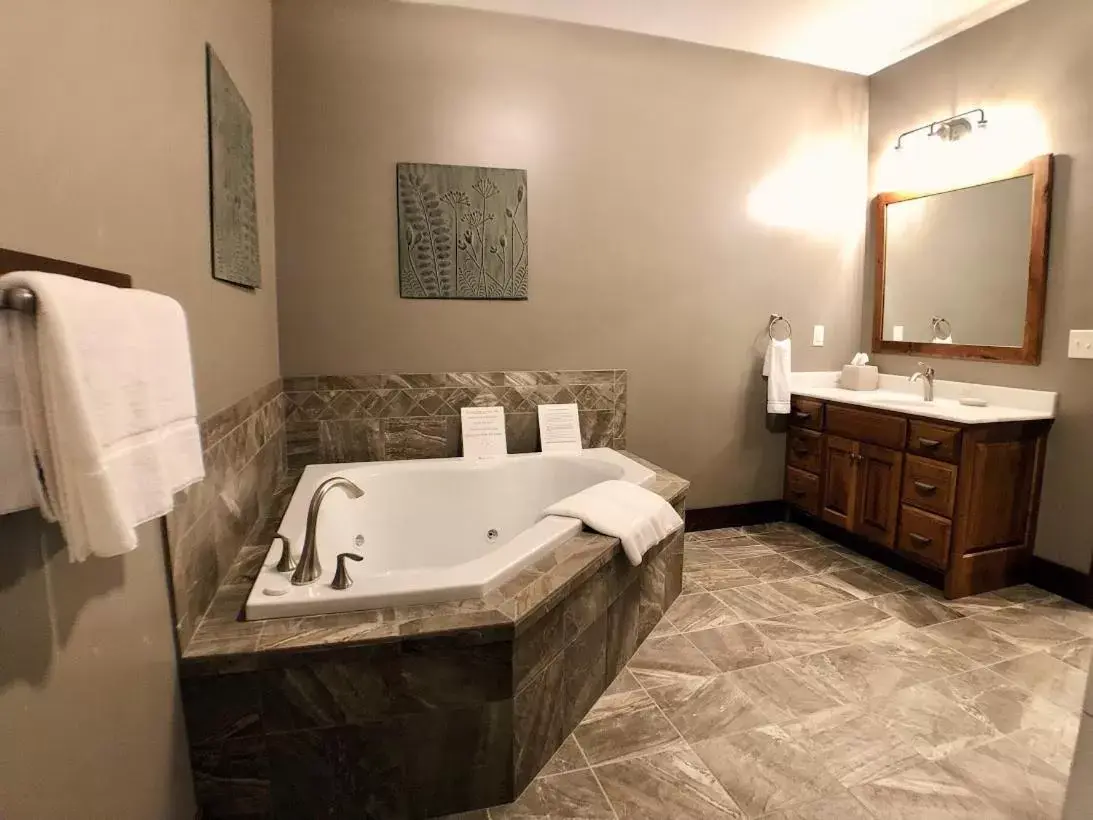 Bathroom in Sojourner's Lodge & Log Cabin Suites