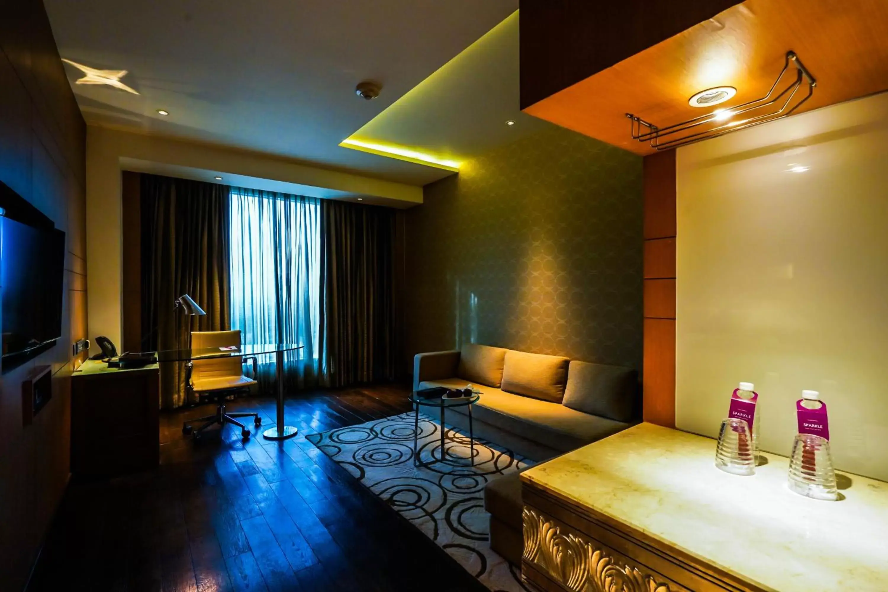 TV and multimedia, Seating Area in Crowne Plaza Greater Noida, an IHG Hotel