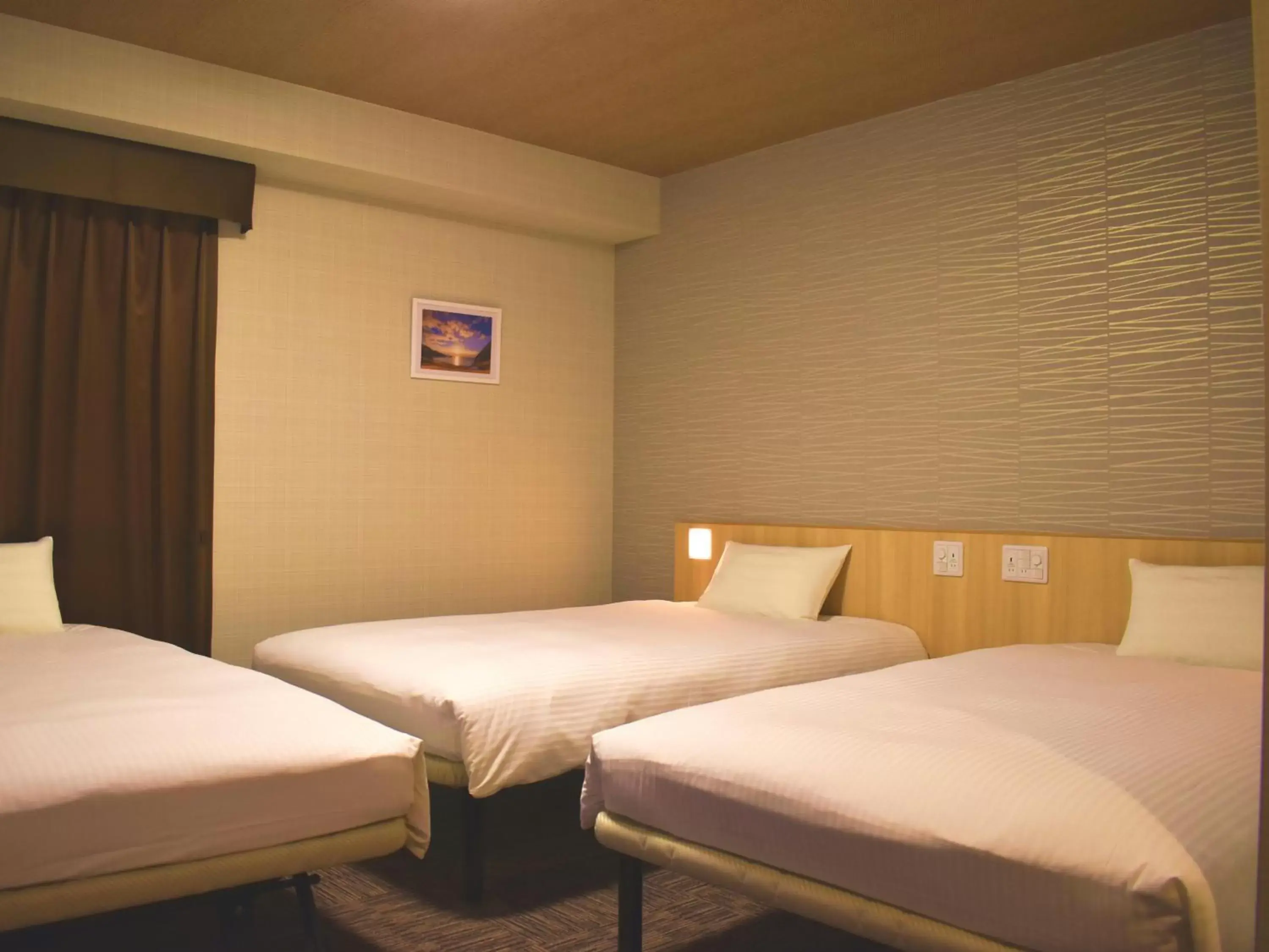 Bed in TABINO HOTEL Sado