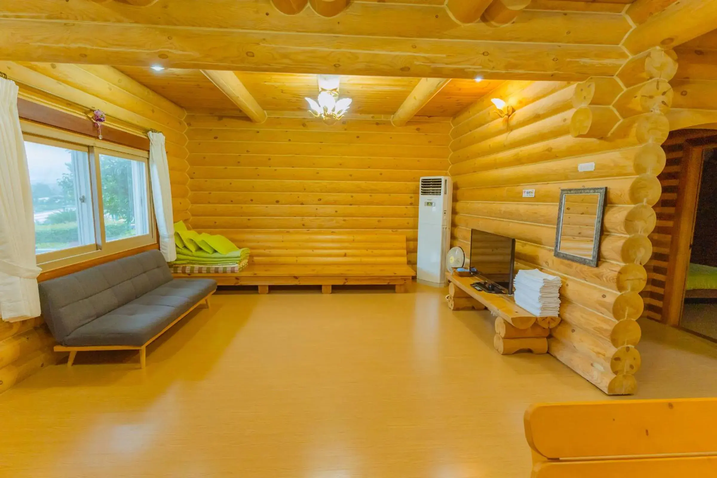 Living room in Jungmun Log Pension & Resort Living room in Jungmun Log Pension & Resort