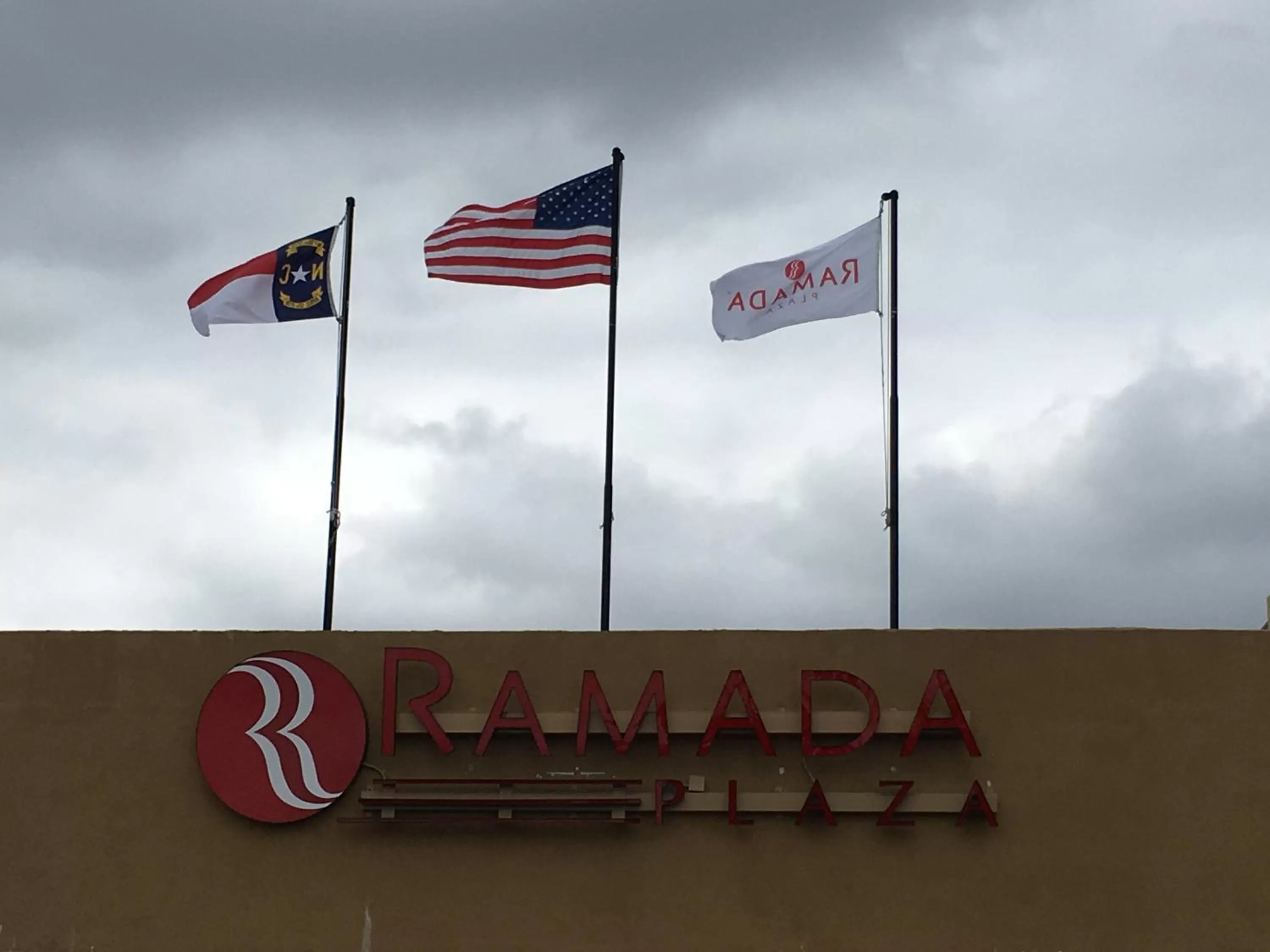 Property logo or sign in Ramada Plaza by Wyndham Charlotte South End Airport