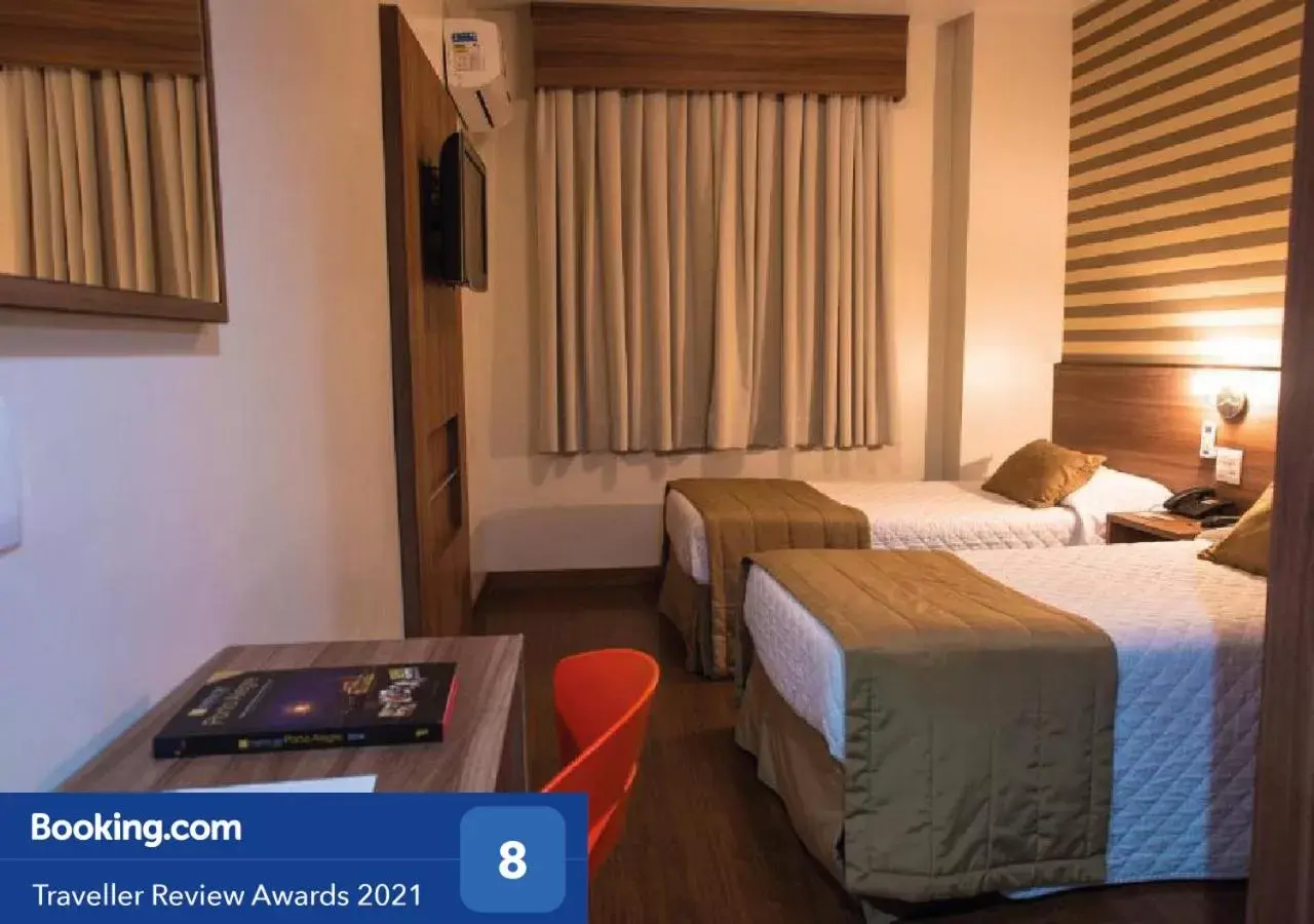 Photo of the whole room in Hotel Continental Business - 200 metros do Complexo Hospitalar Santa Casa