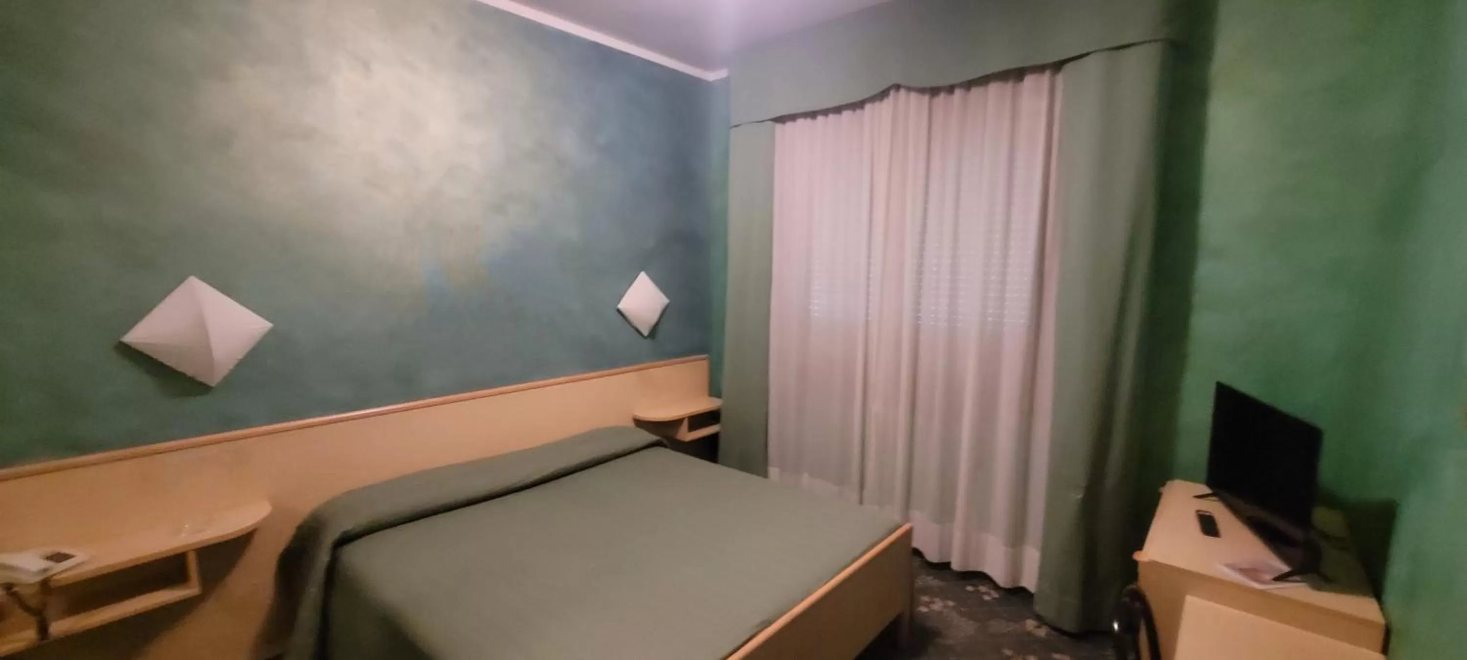 Bed in HOTEL PARADISO