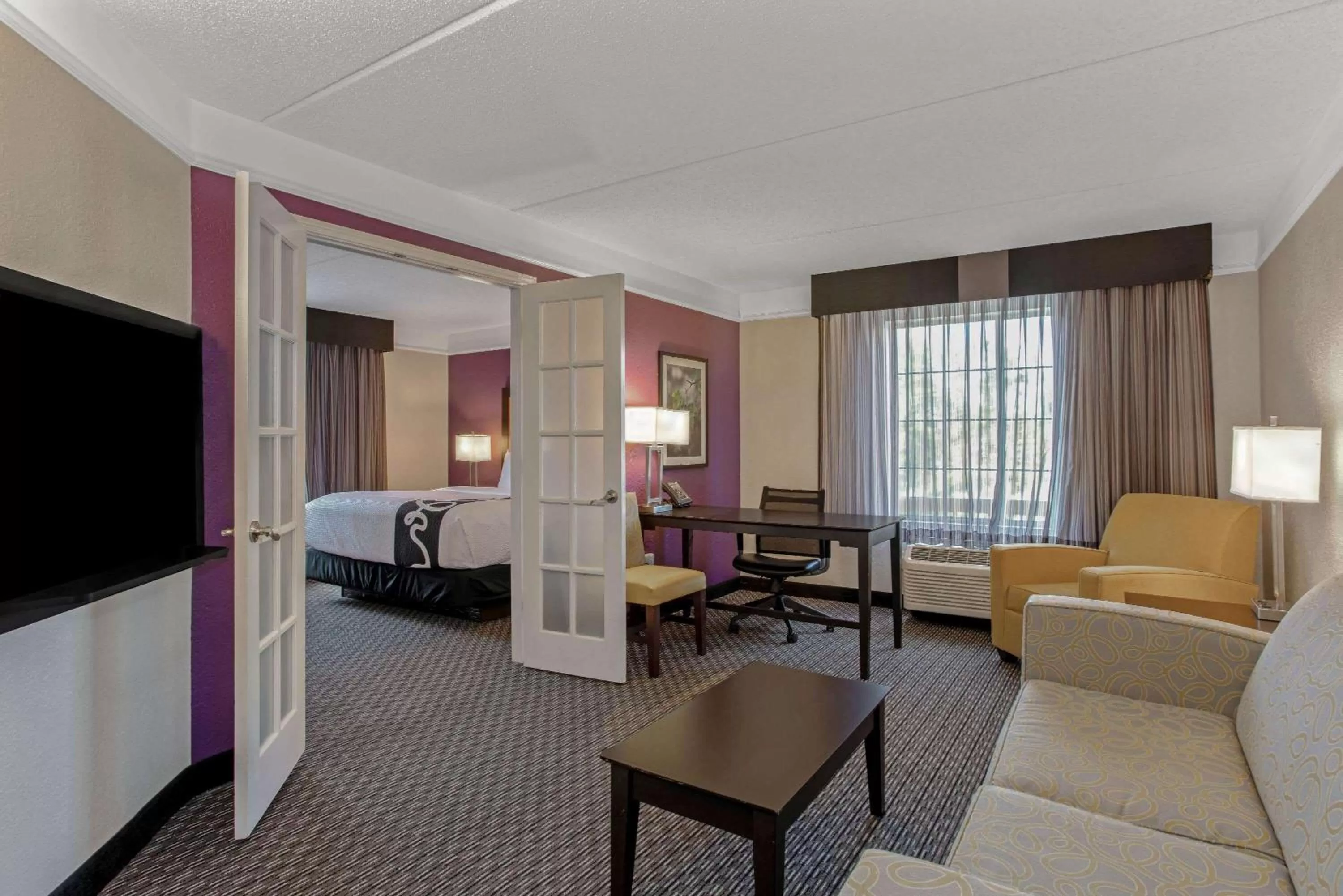 Photo of the whole room, Bed in La Quinta by Wyndham Orlando Airport North - Free Airport Shuttle!