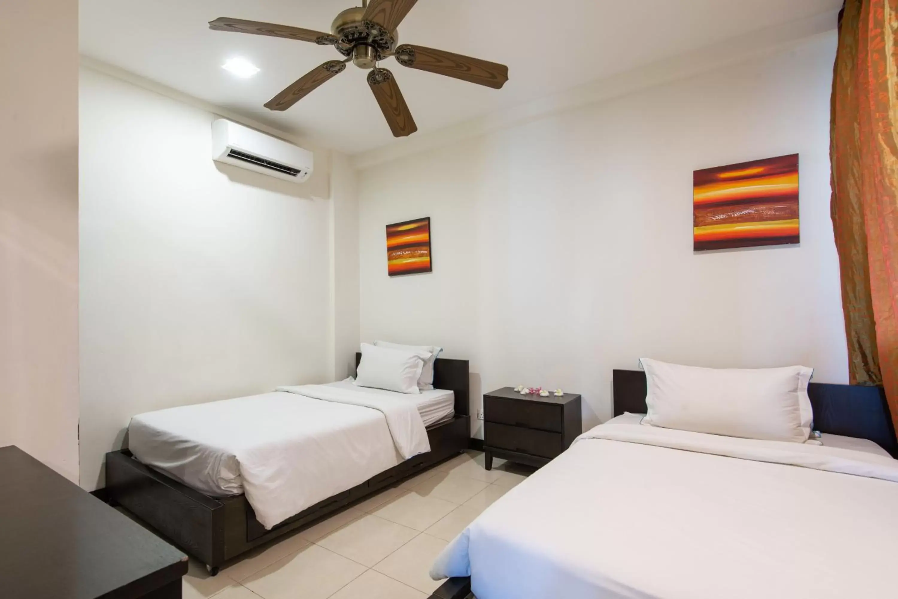 Bed in Sabah Beach Villas & Suites