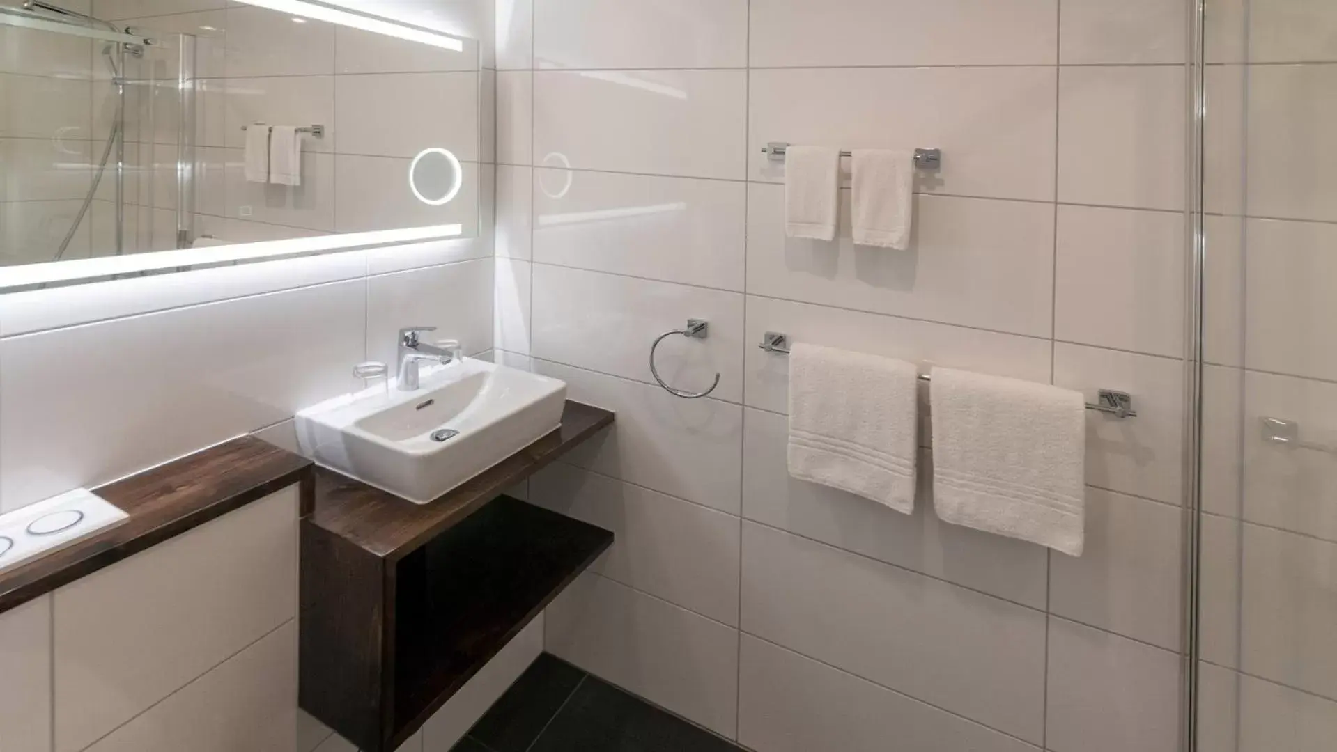 Bathroom in Swiss Inn & Apartments