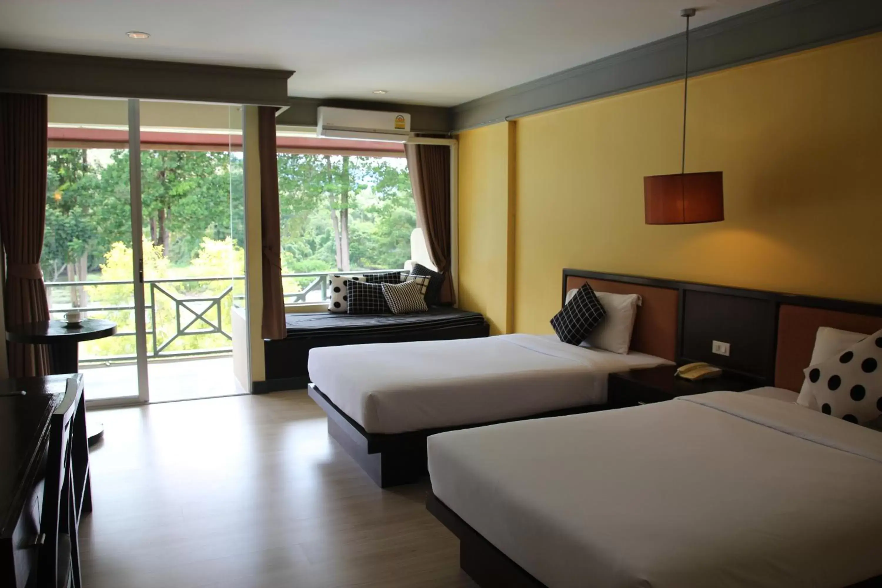 Bed in Aekpailin River Kwai Resort