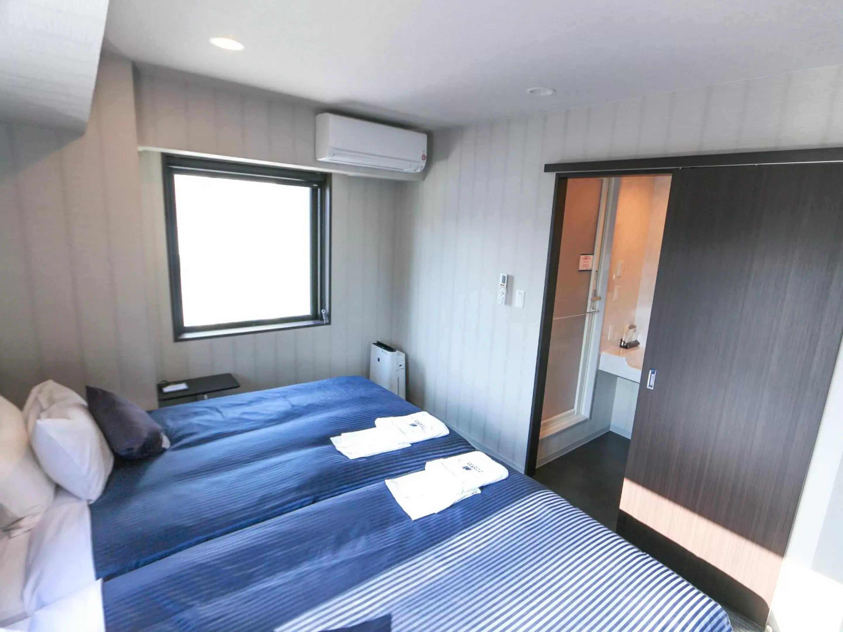 Bed in HOTEL LiVEMAX Sapporo Susukino Bed in HOTEL LiVEMAX Sapporo Susukino