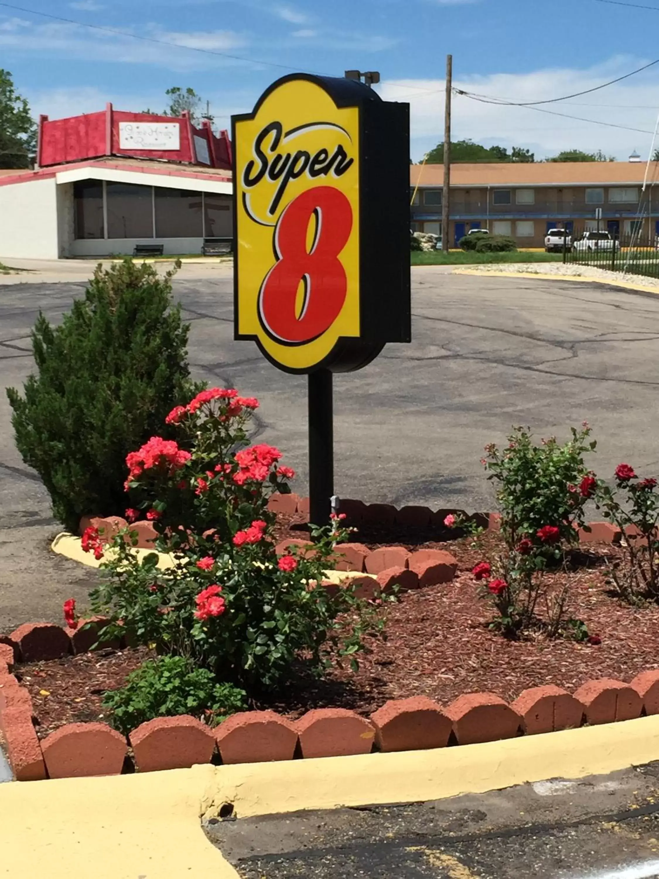 Property logo or sign in Super 8 by Wyndham Junction City