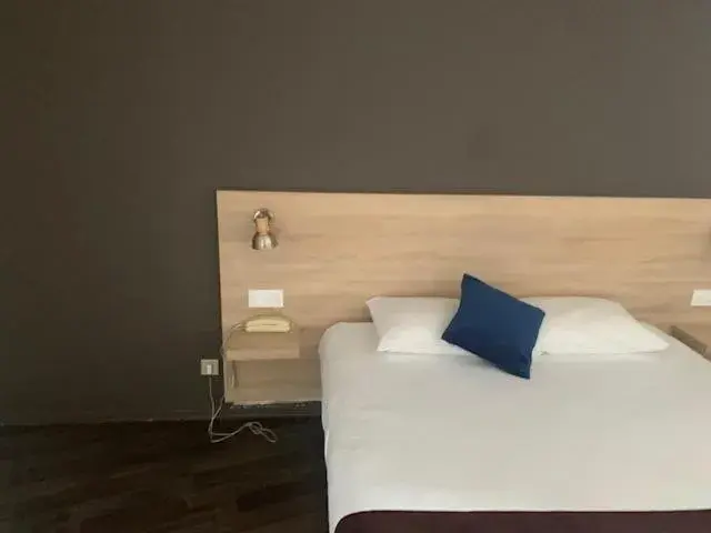 Bed in Hôtel des Etats-Unis