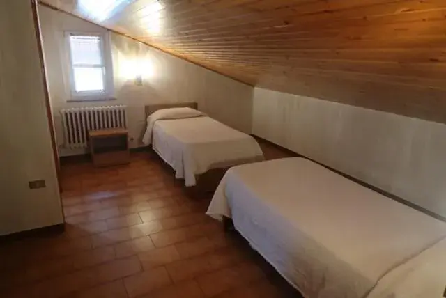 Bed in Hotel Riposo