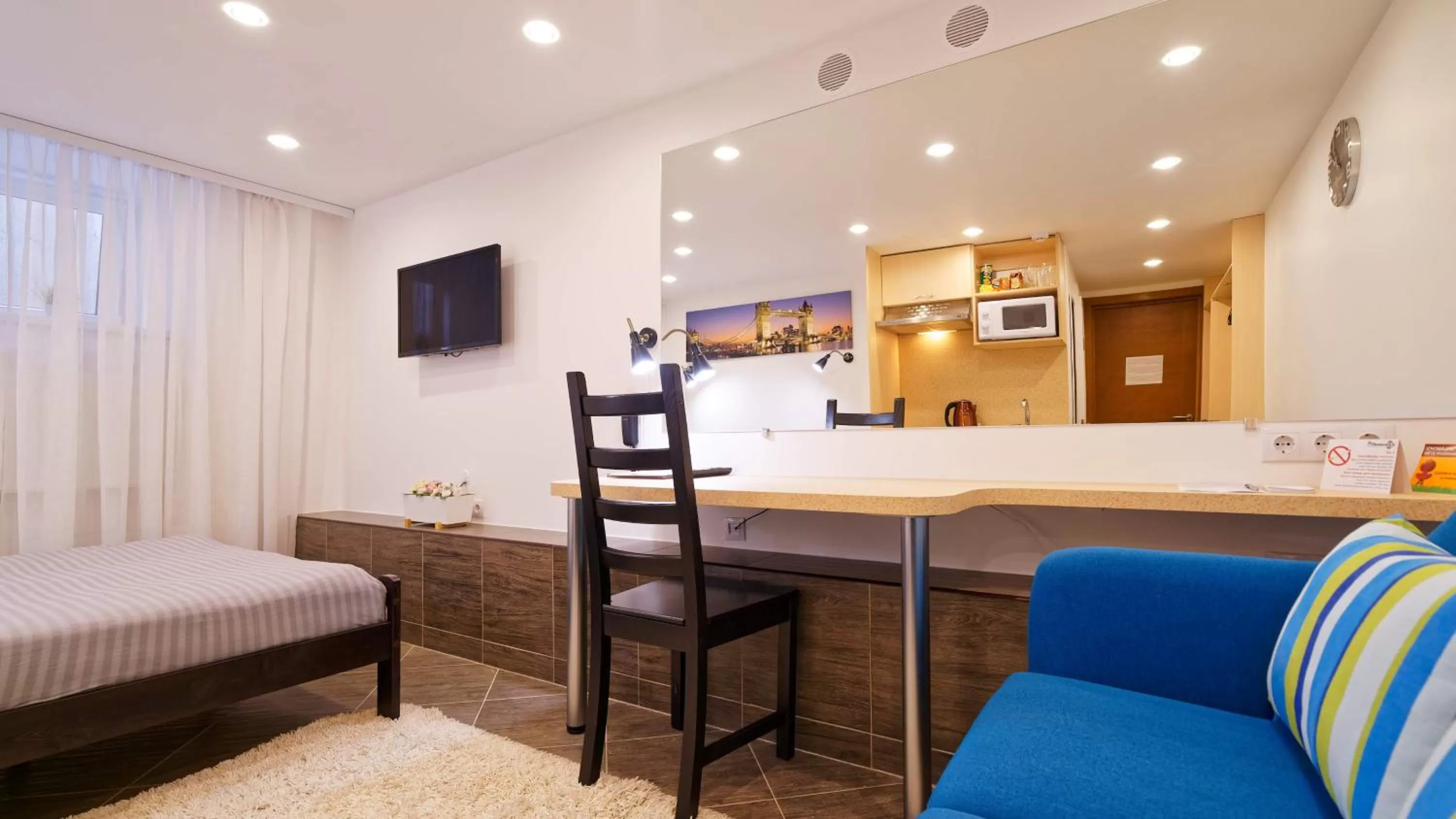 TV and multimedia in RIGAAPARTMENT SONADA Family Aparthotel - Private Parking