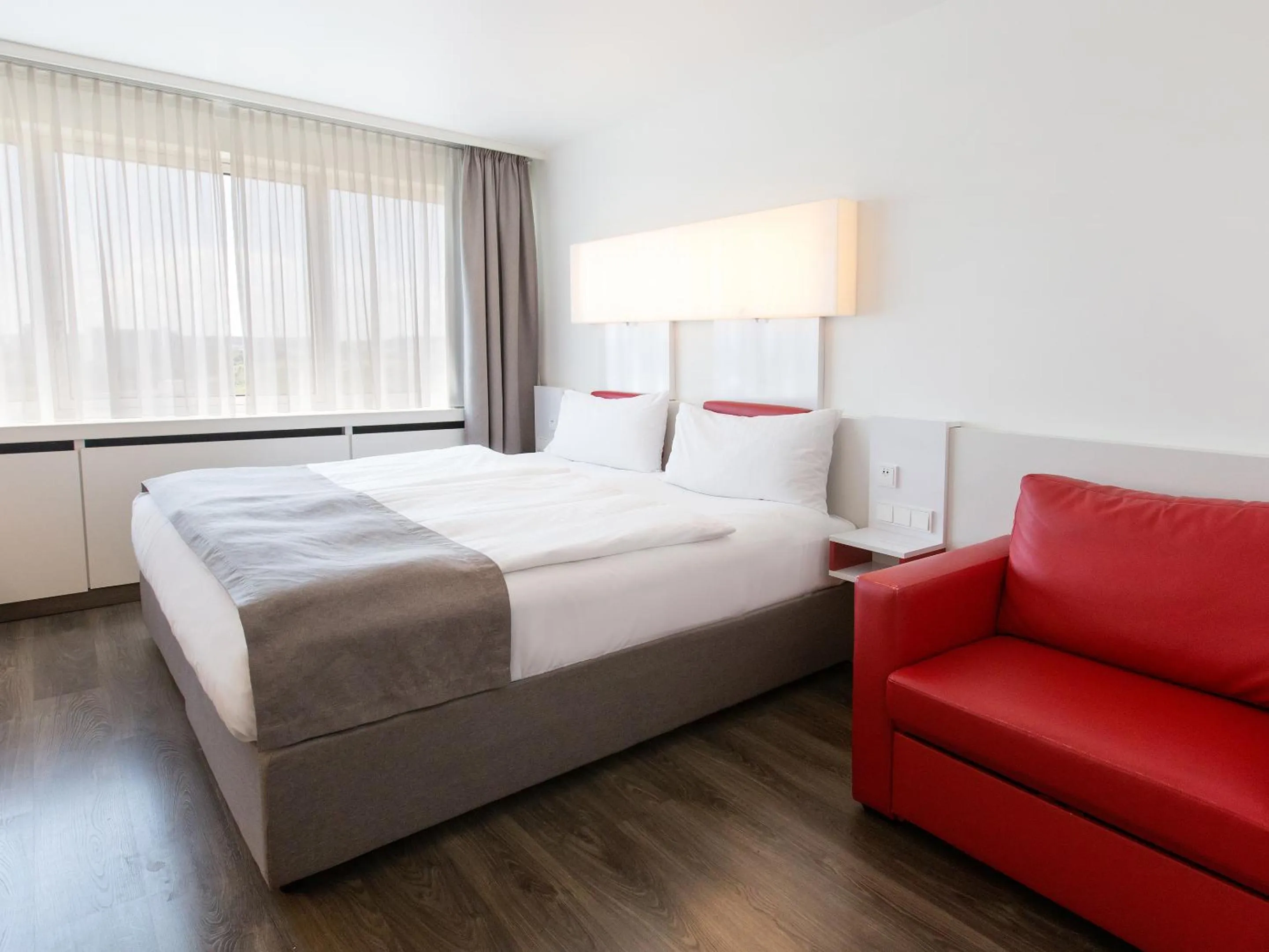 Photo of the whole room, Bed in DORMERO Hotel Stuttgart