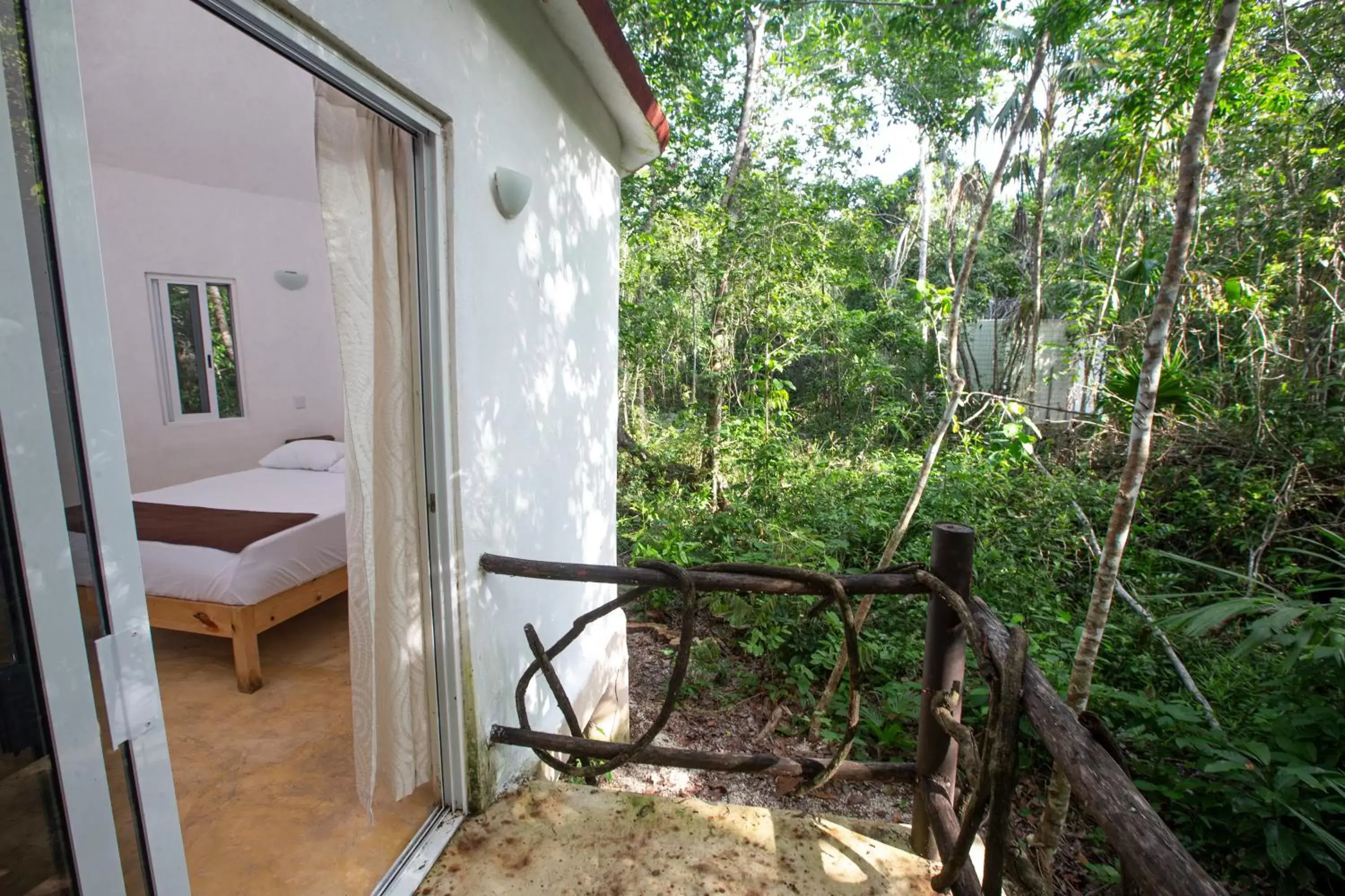 Bed, Balcony/Terrace in Jolie Jungle Eco Hotel