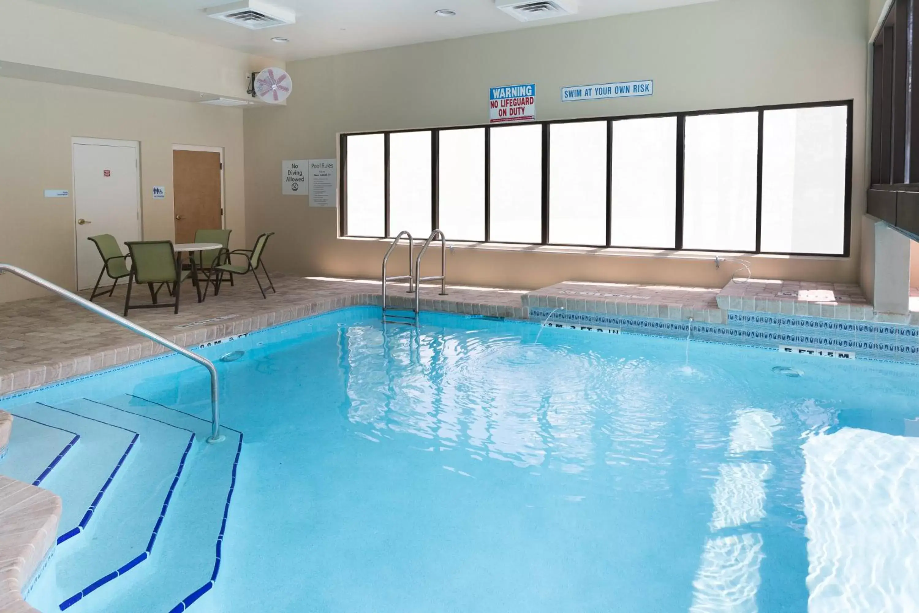Swimming Pool in Holiday Inn Express Hotel & Suites Jacksonville Airport, an IHG Hotel