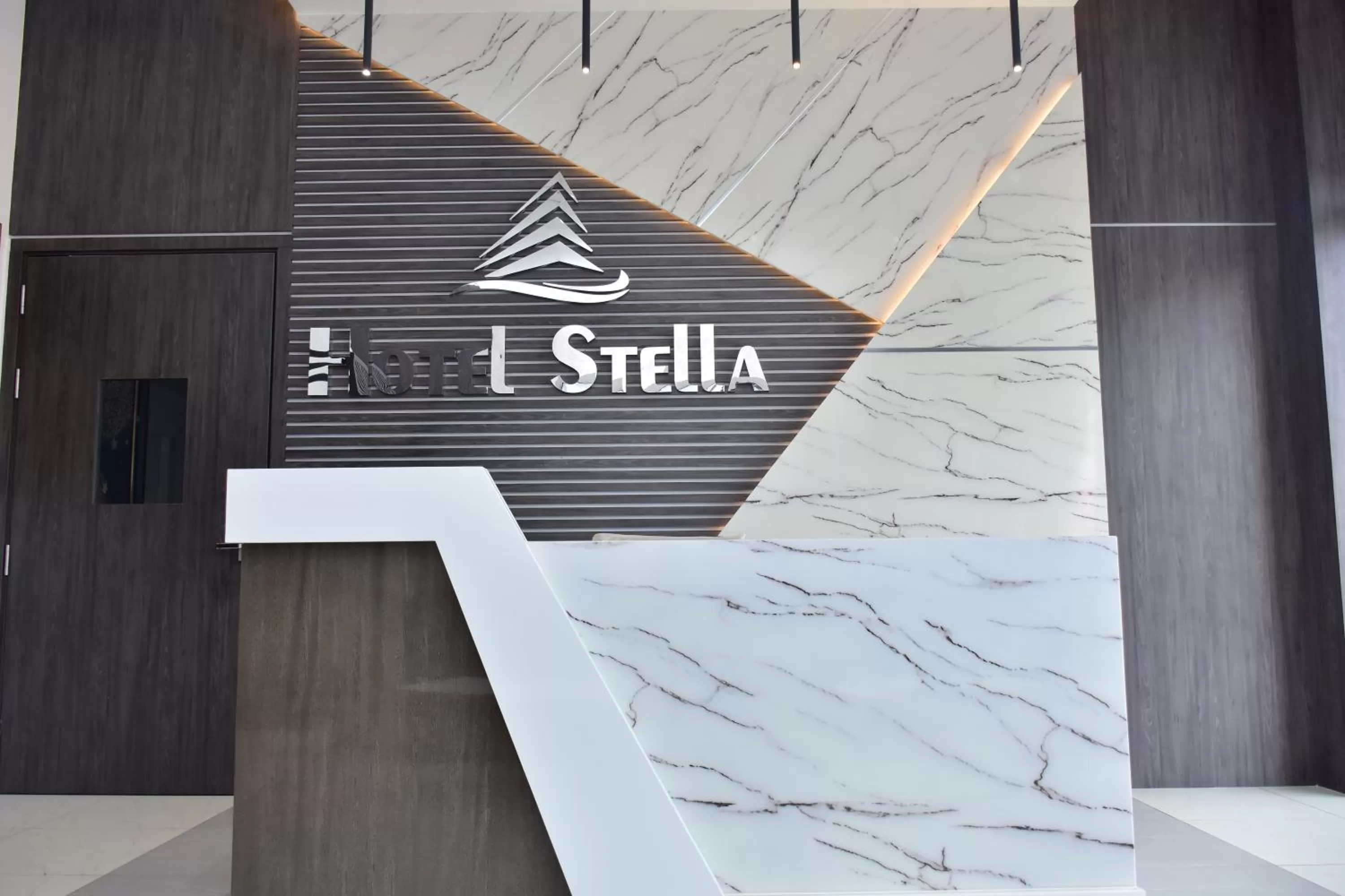 Property logo or sign in Hotel Stella