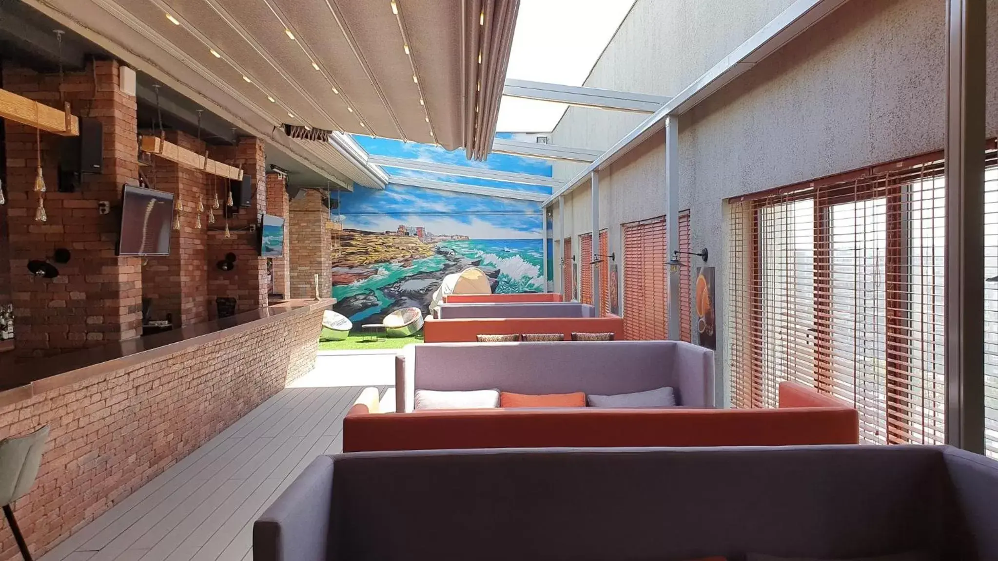 Lounge or bar, Balcony/Terrace in Holiday Inn Aktau, an IHG Hotel
