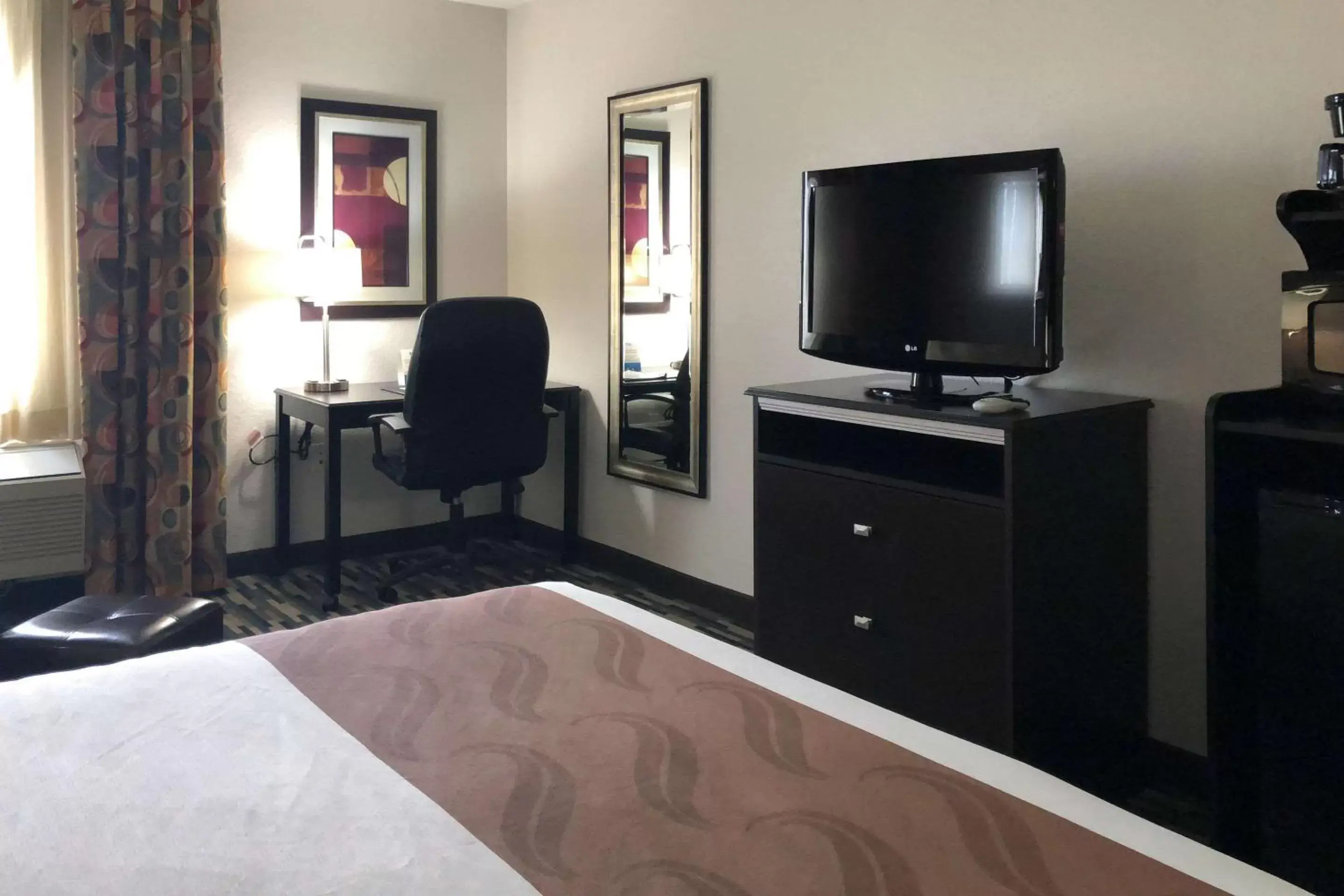 Photo of the whole room, TV/Entertainment Center in Quality Inn & Suites Denver International Airport