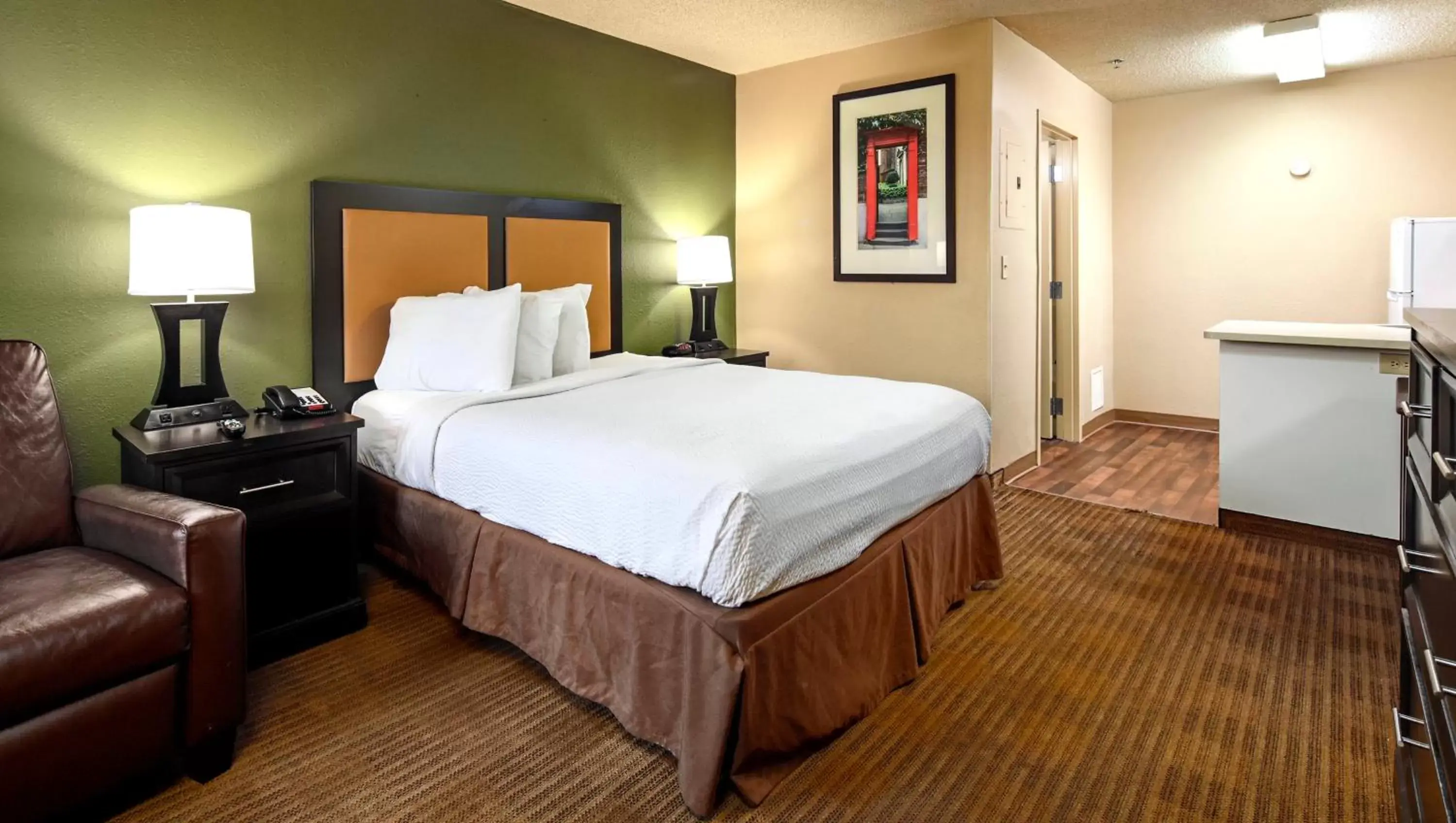 Bedroom, Bed in Home 1 Suites Extended Stay