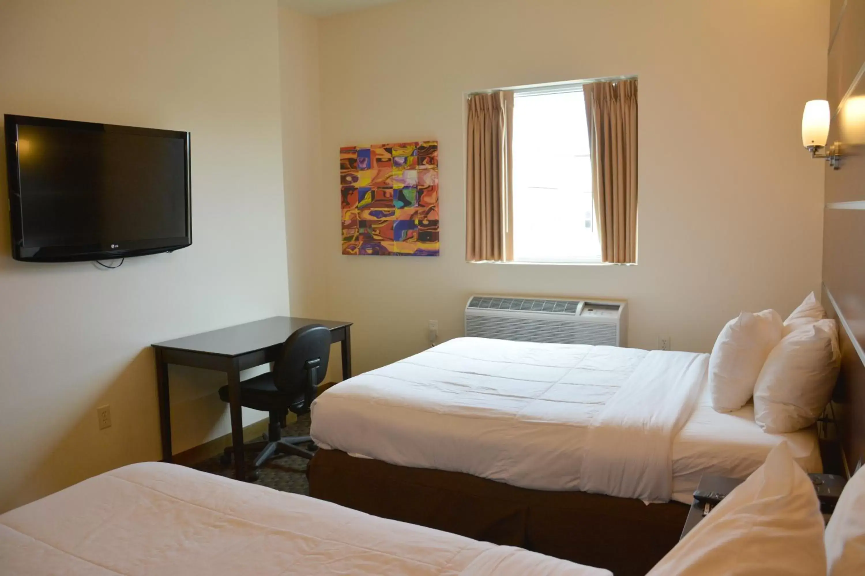 Deluxe Queen Room with Two Queen Beds - Non-Smoking in Days Inn & Suites by Wyndham Milwaukee