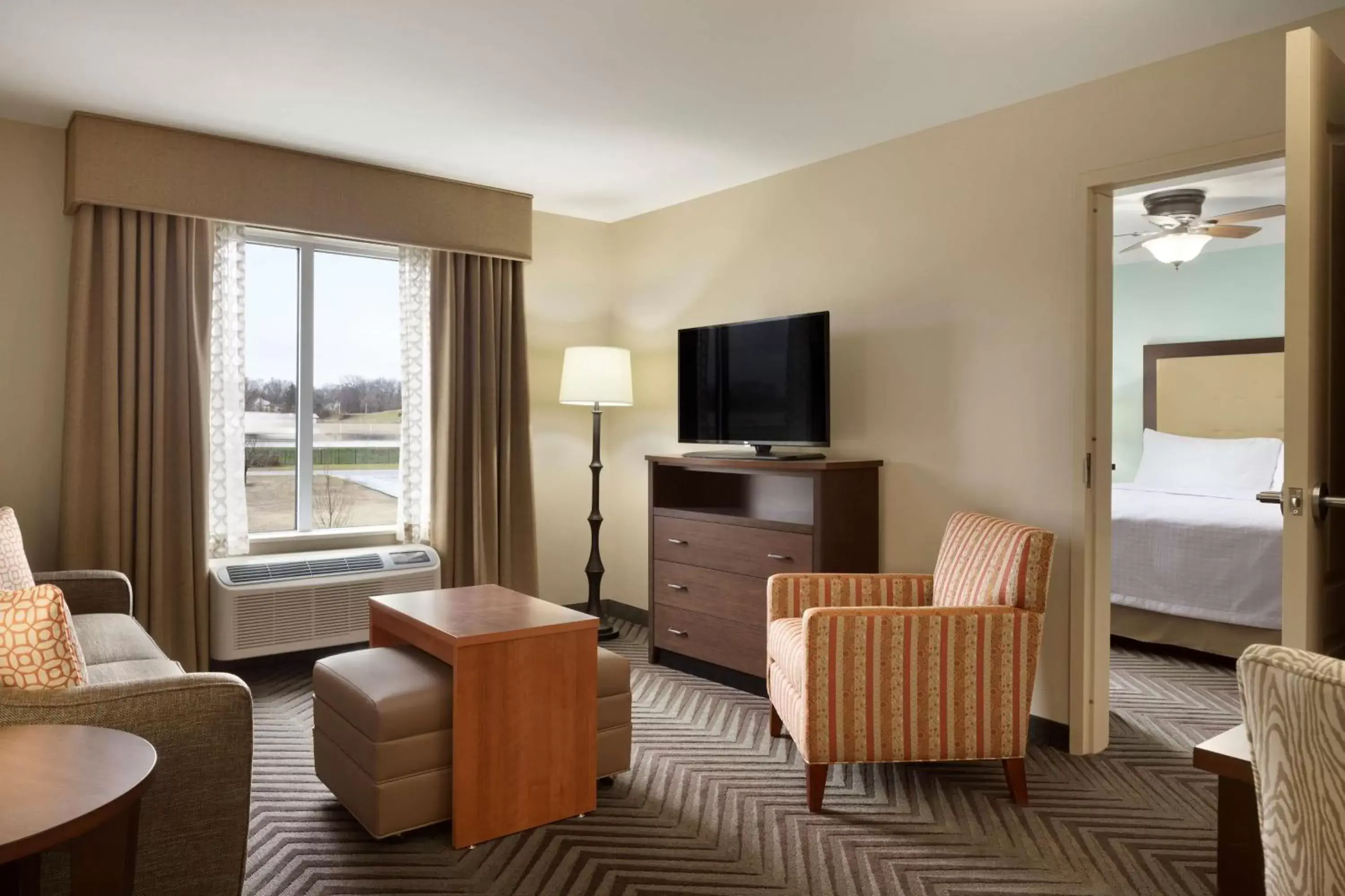 Bed, Seating Area in Homewood Suites by Hilton Kalamazoo-Portage