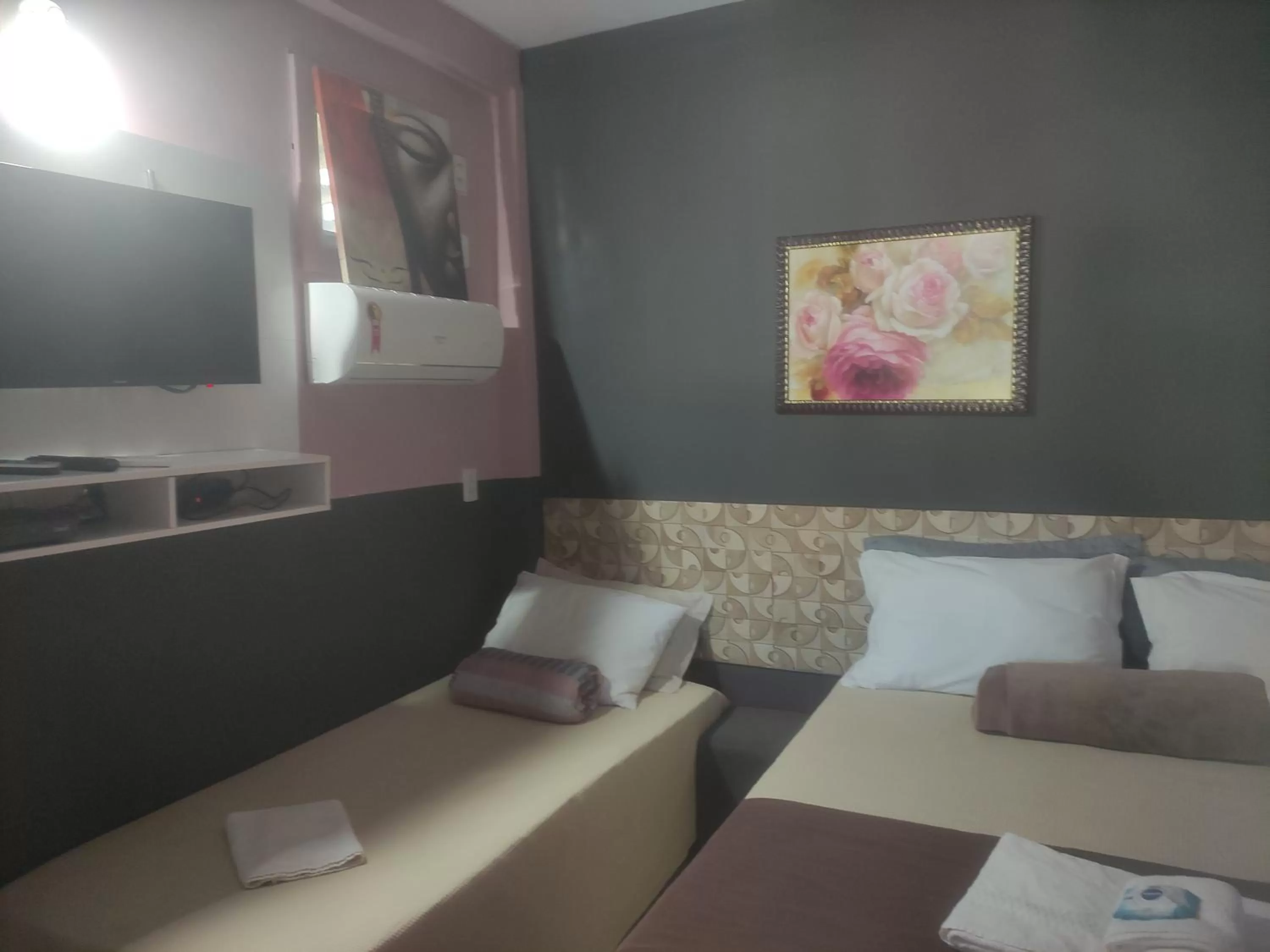 Bed in Pousada da Gi Suítes e Turismo