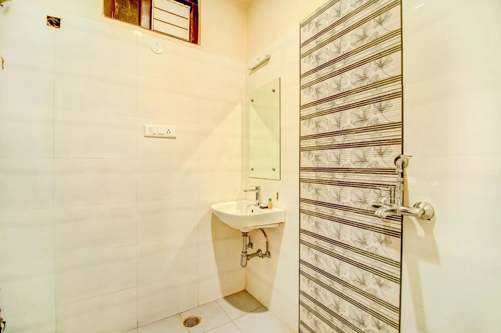 Bathroom in FabHotel Solitaire Inn Tilak Nagar