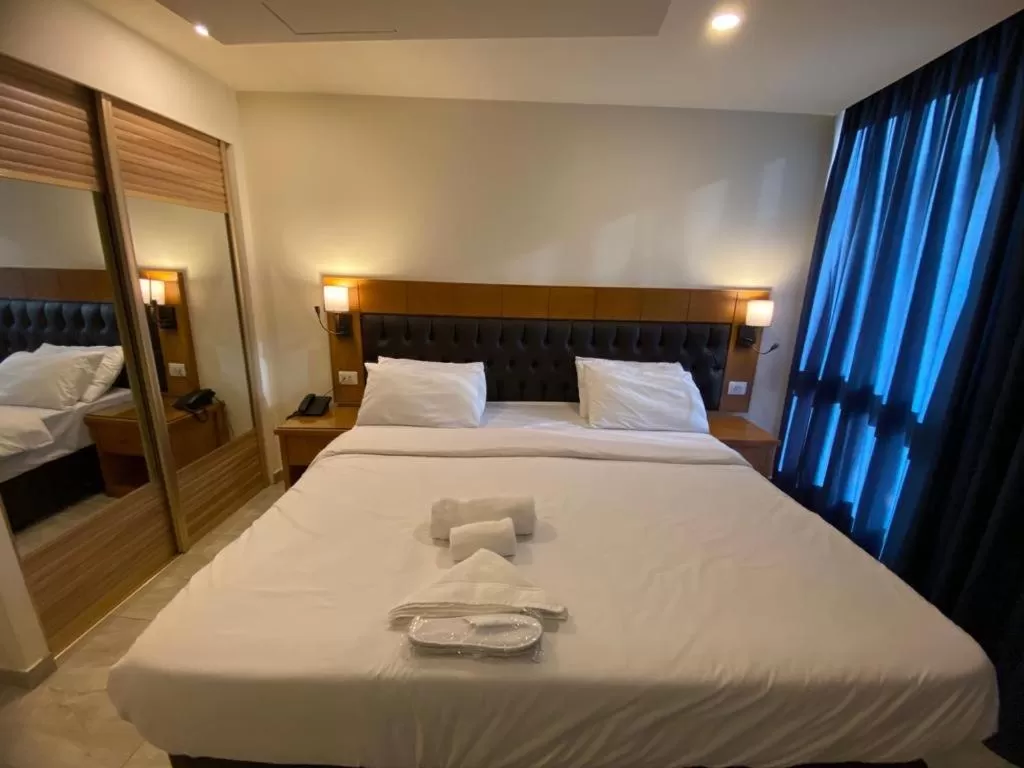 Bed in Jawharet Alswefiah Hotel Suites