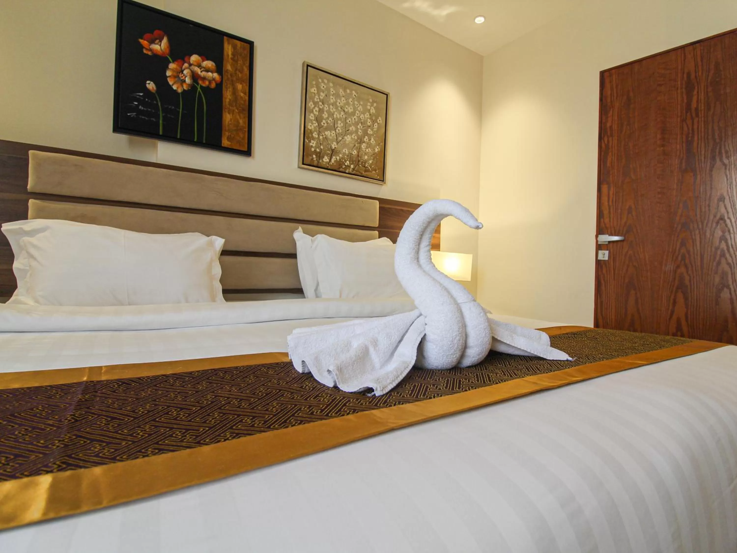 Bed in Friesian Hotel Suites