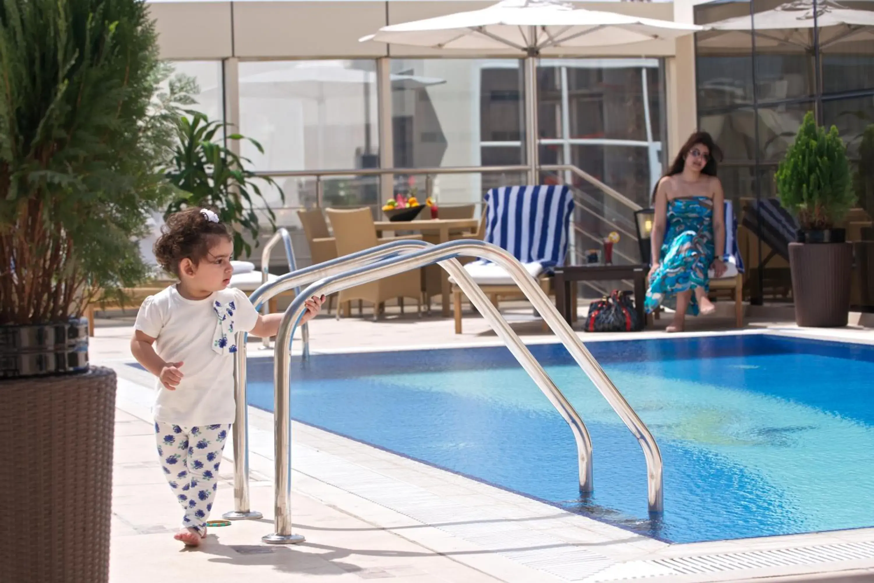 People, Swimming Pool in The Royal Riviera Hotel Doha