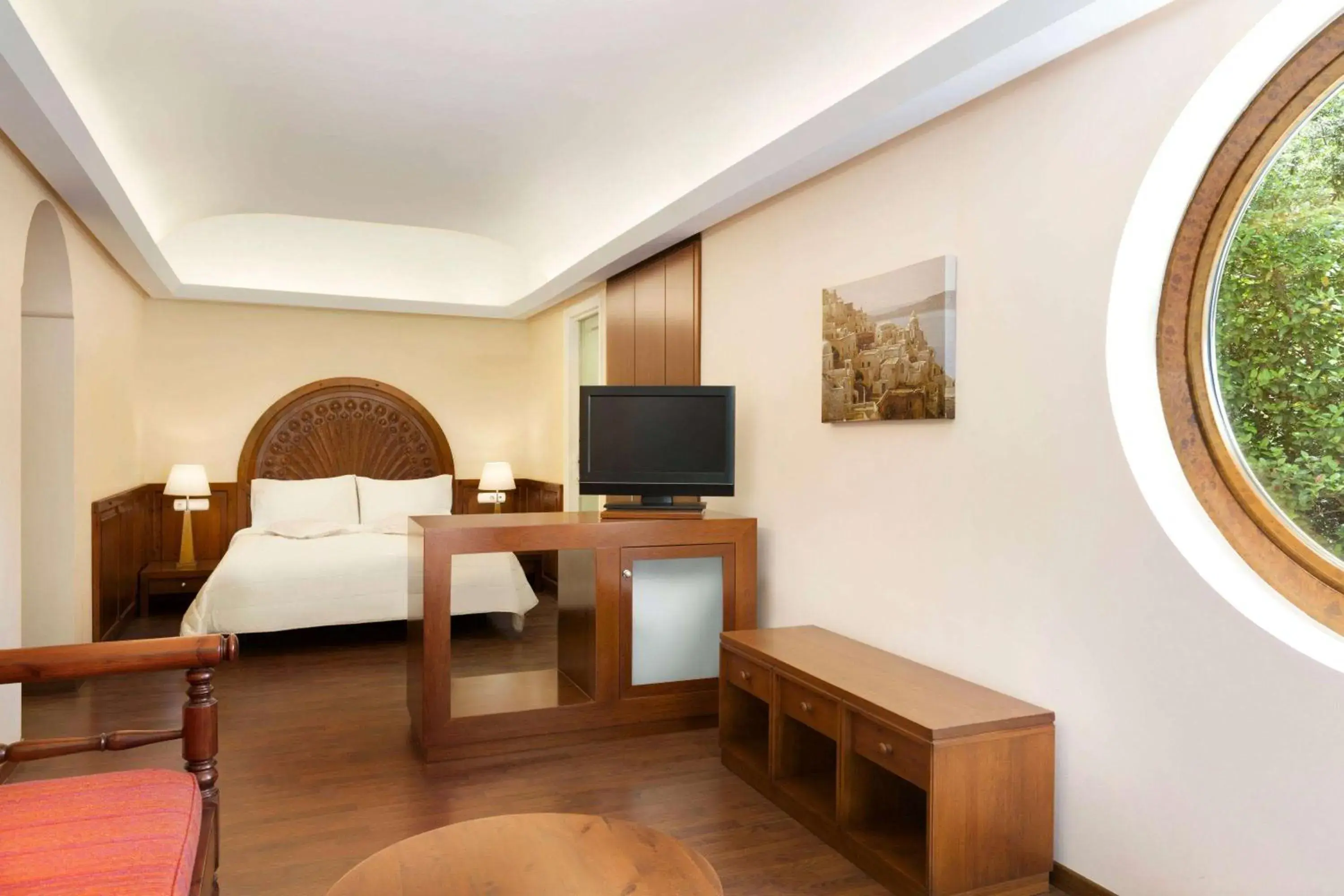 Bed, TV/Entertainment Center in Ramada Loutraki Poseidon Resort