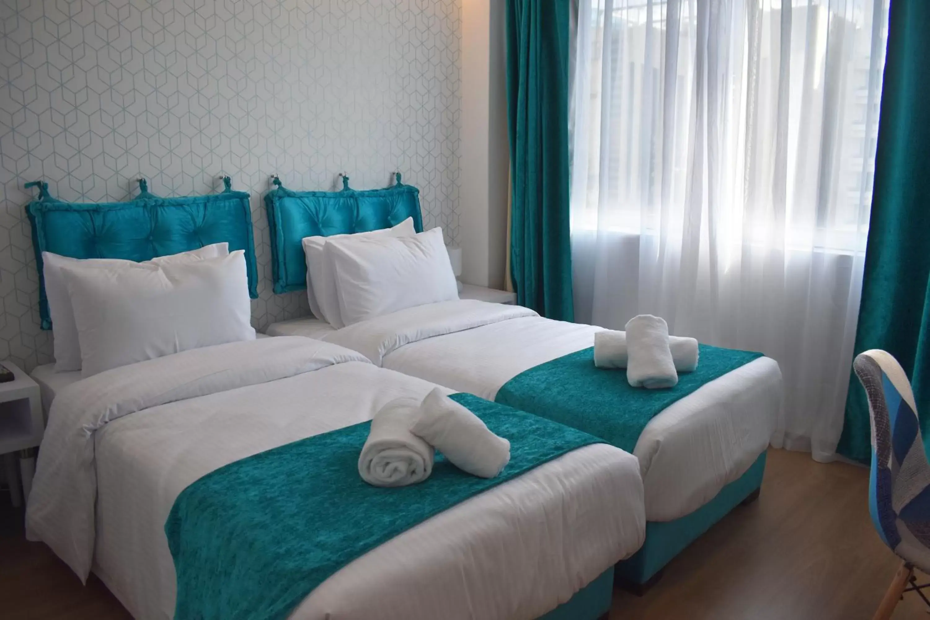Bed in Athenian Montaza Hotel