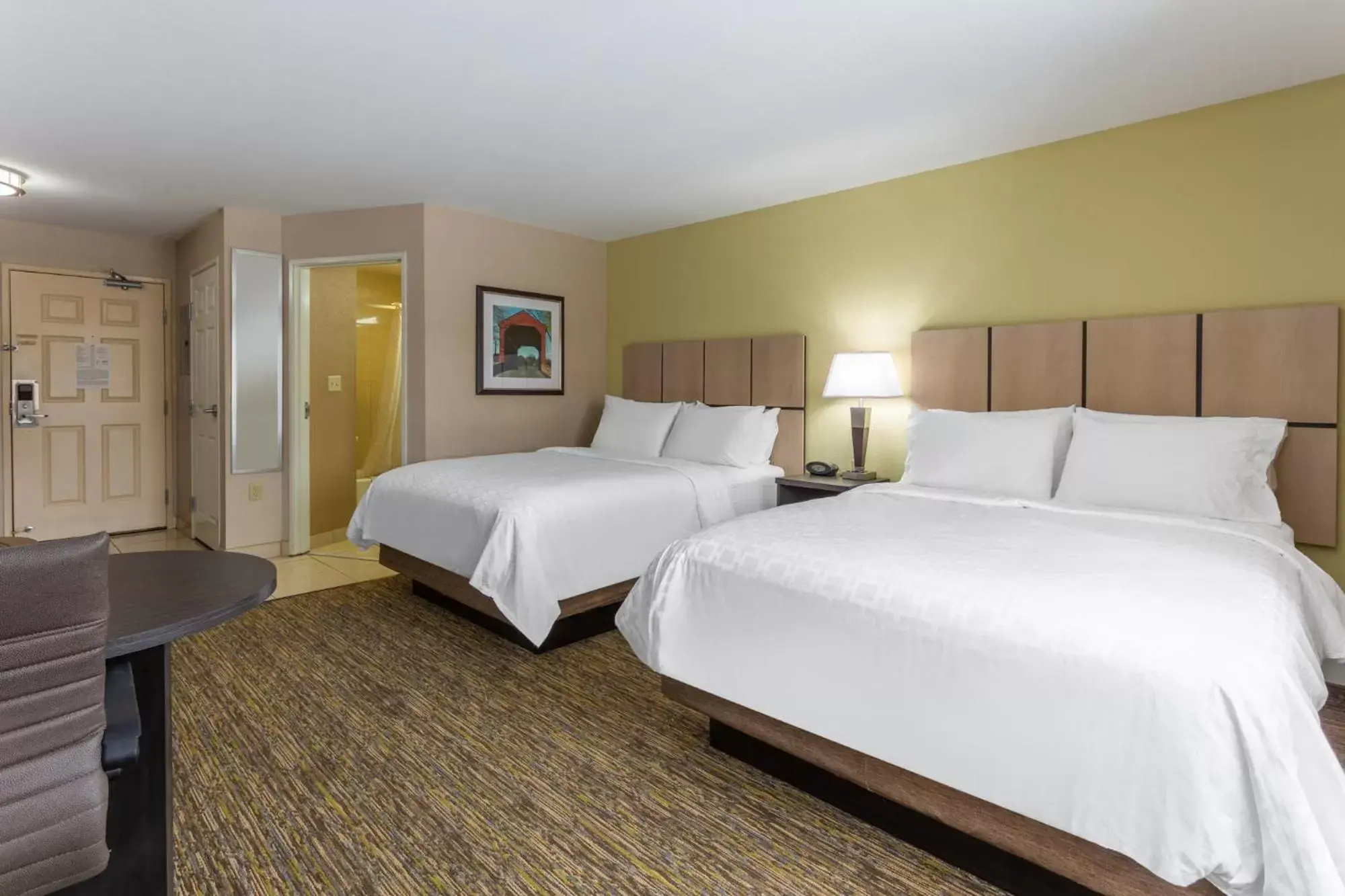 Bed in Candlewood Suites South Bend Airport, an IHG Hotel