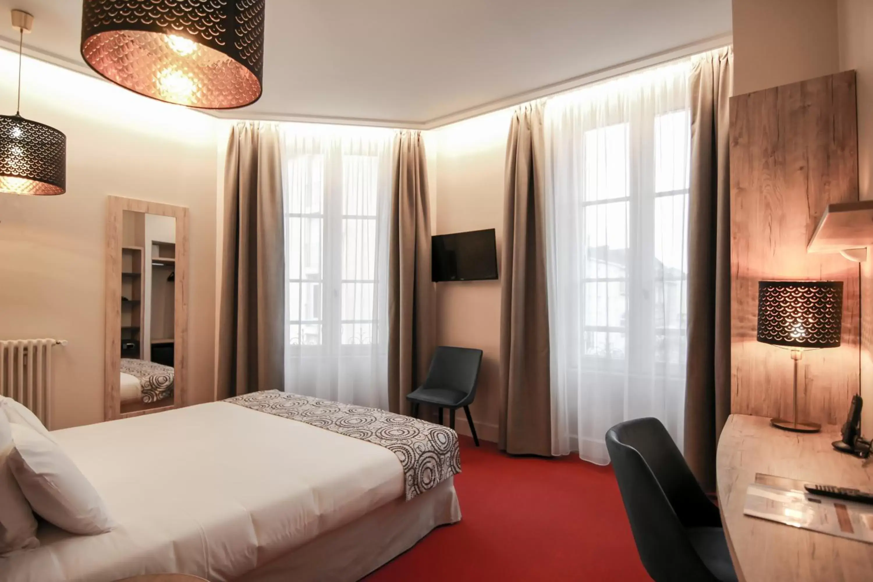 Bed in Hôtel Montaigne