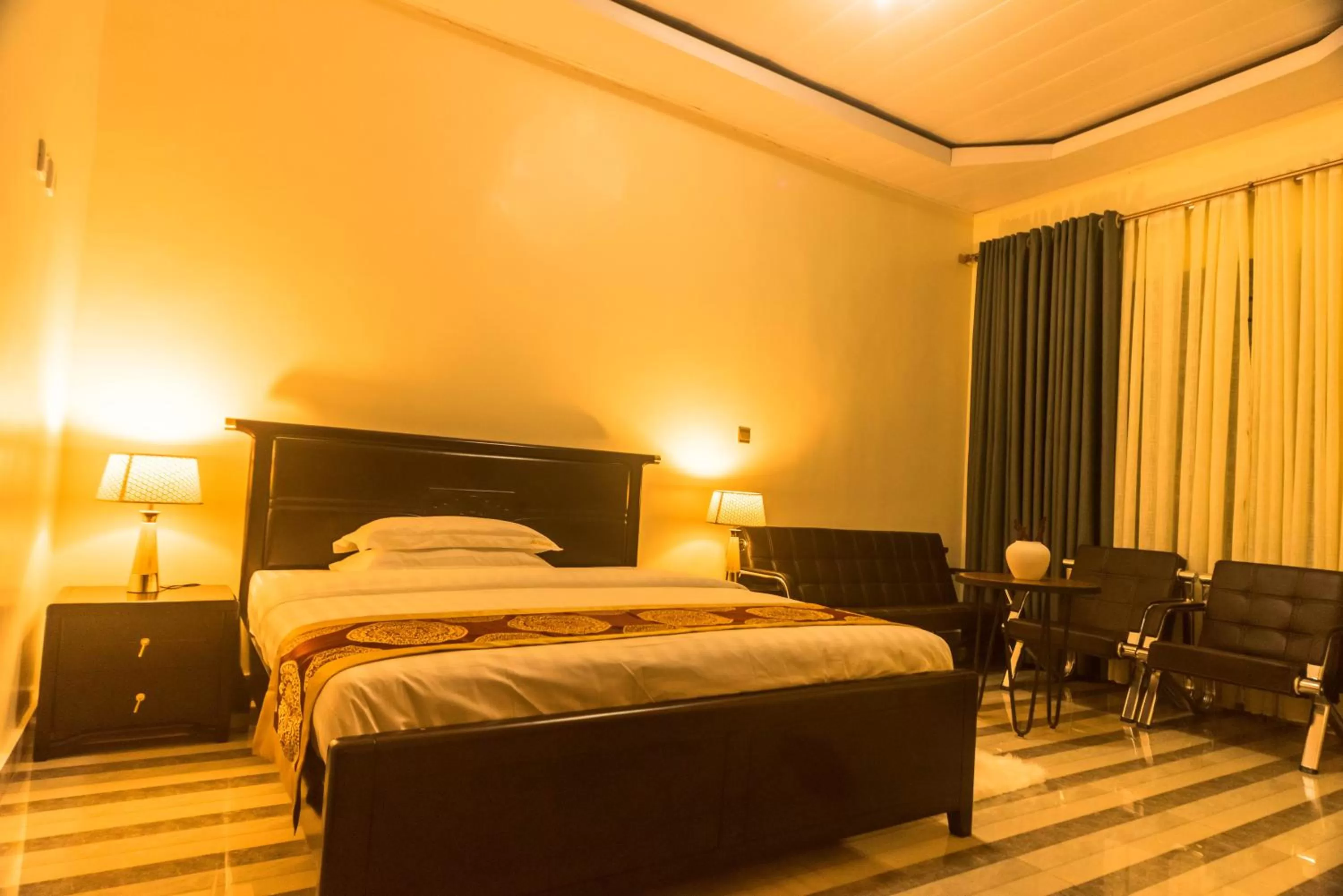 Bed in AVISHA TOWN HOTEL